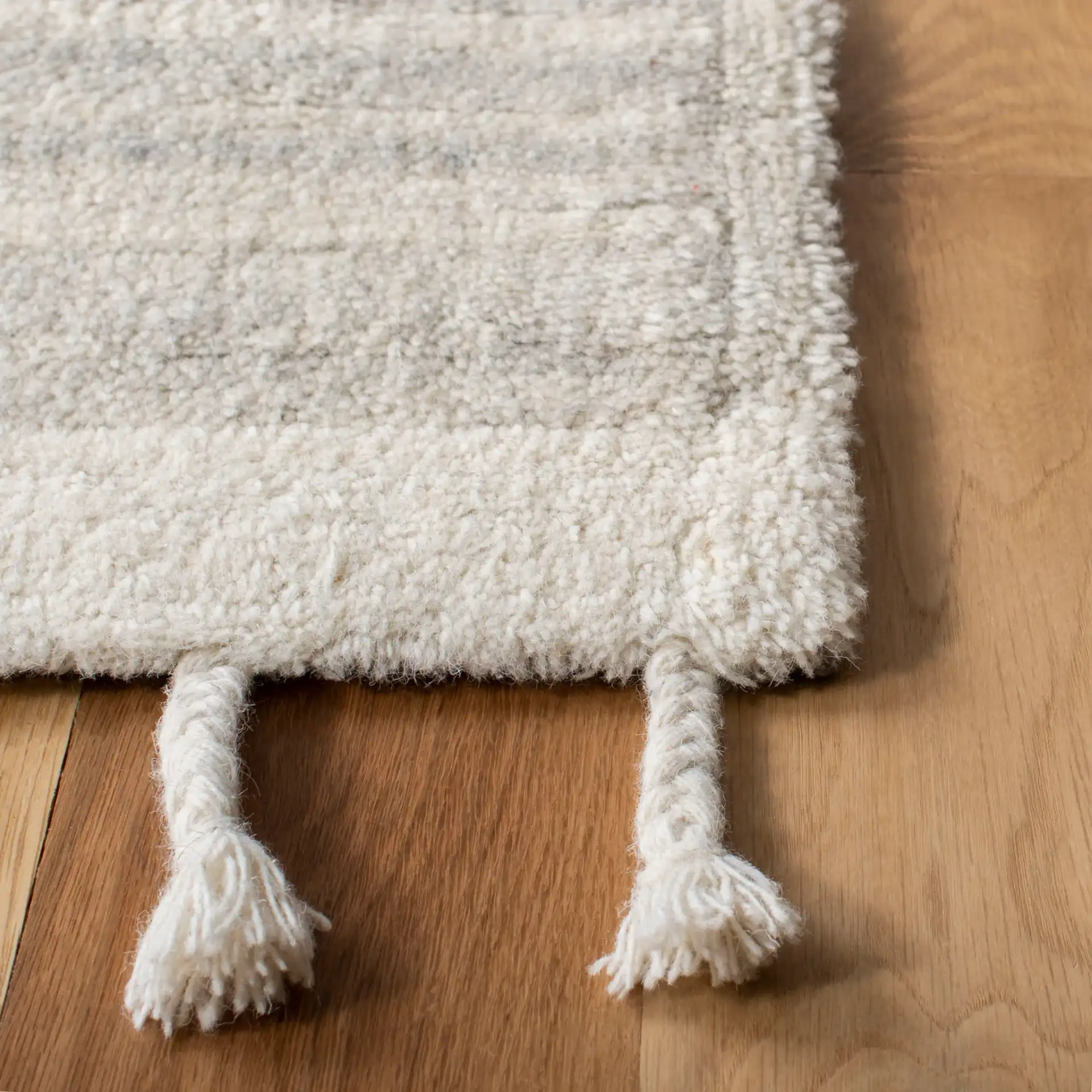 Casablanca Nested Diamond Hand-Tufted Wool Rug in Beige / Ivory in a styled room
