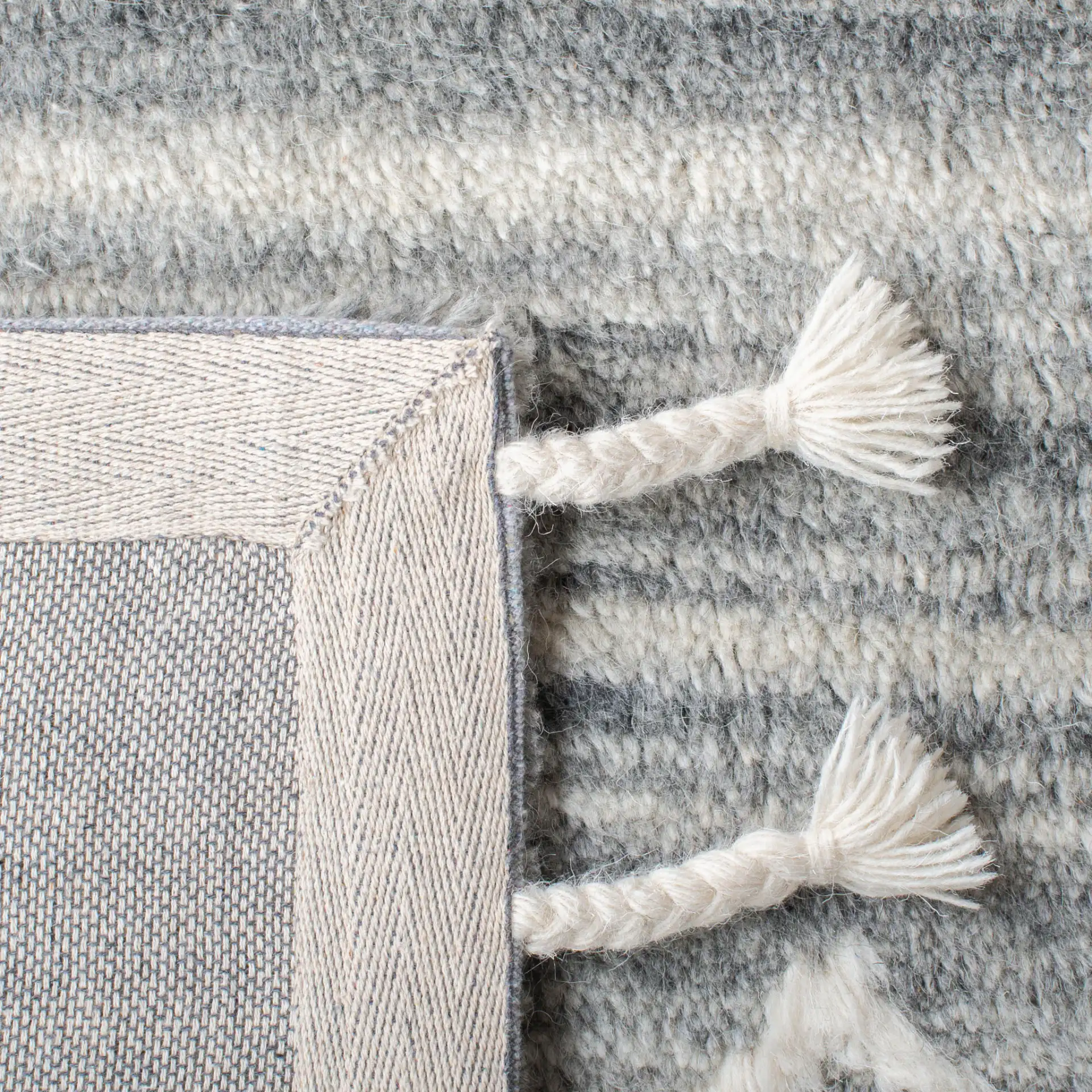 Casablanca Concentric Diamond Hand-Tufted Wool Rug in Gray / Ivory in a styled room