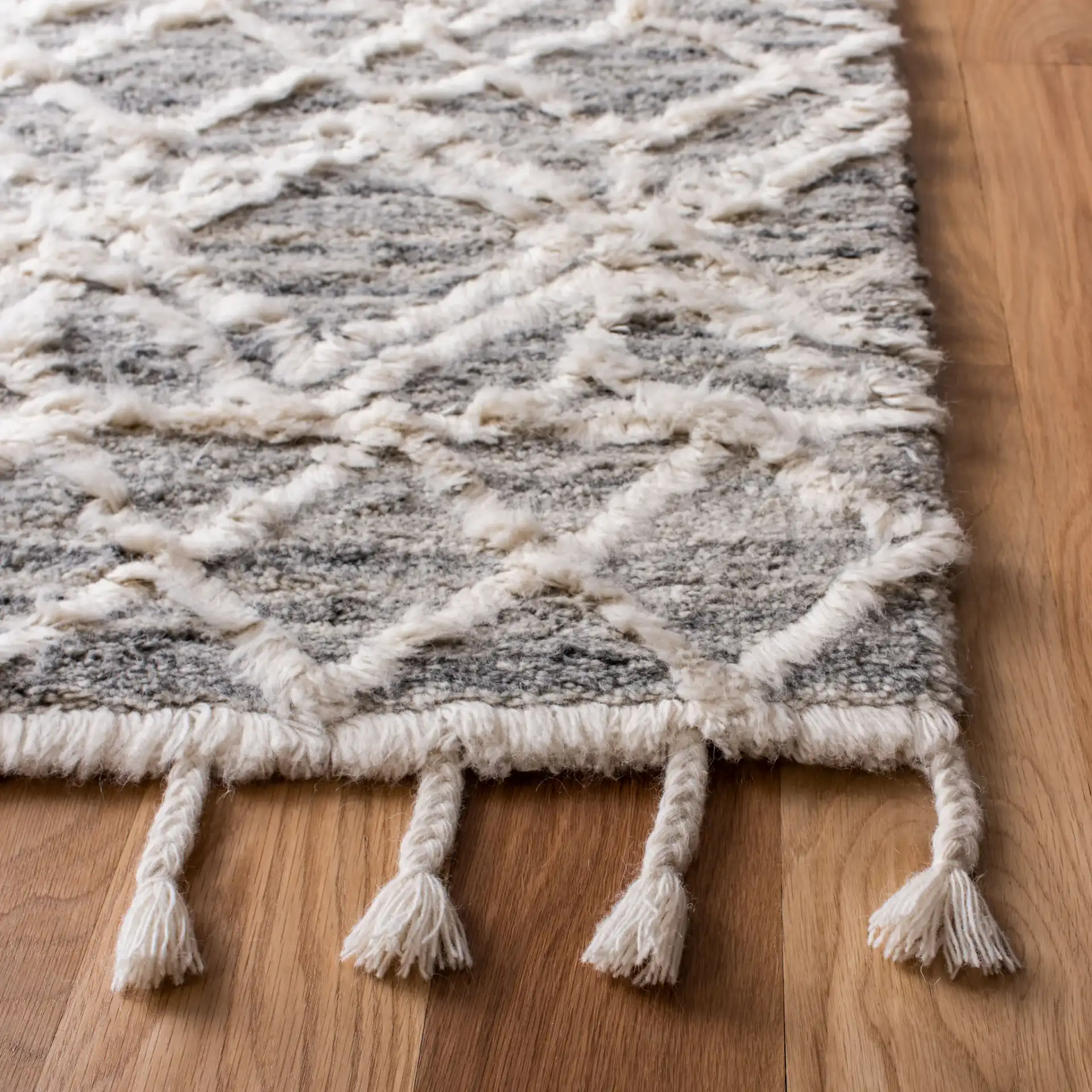 Casablanca Geometric Diamond Trellis Hand-Tufted Wool Rug in Gray / Ivory in a styled room