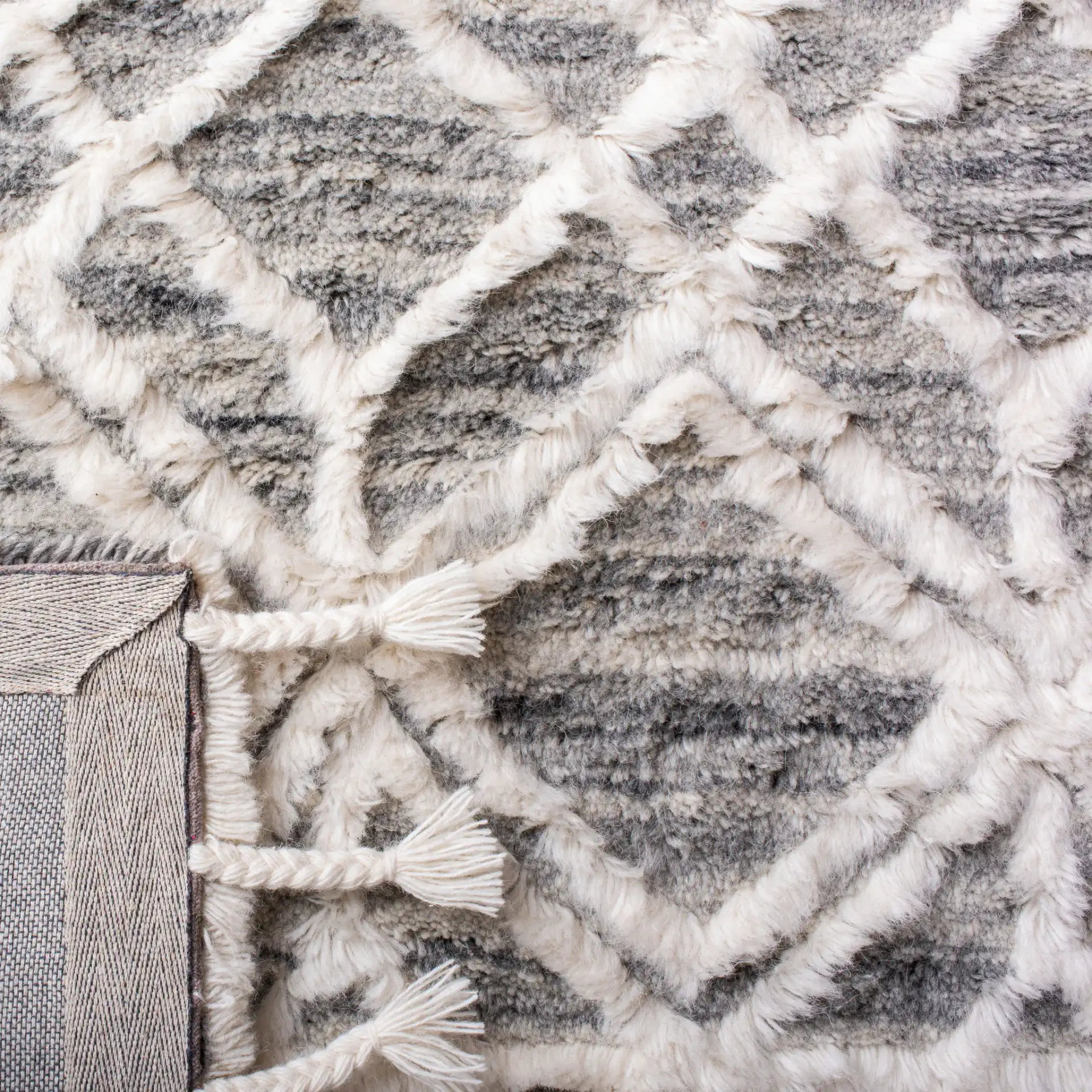 Casablanca Geometric Diamond Trellis Hand-Tufted Wool Rug in Gray / Ivory in a styled room