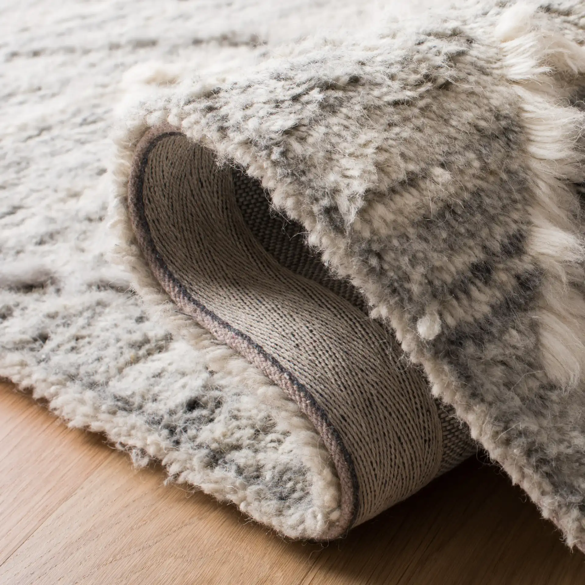 Casablanca Abrash Floating Diamond Hand-Tufted Wool Rug in Gray / Ivory in a styled room