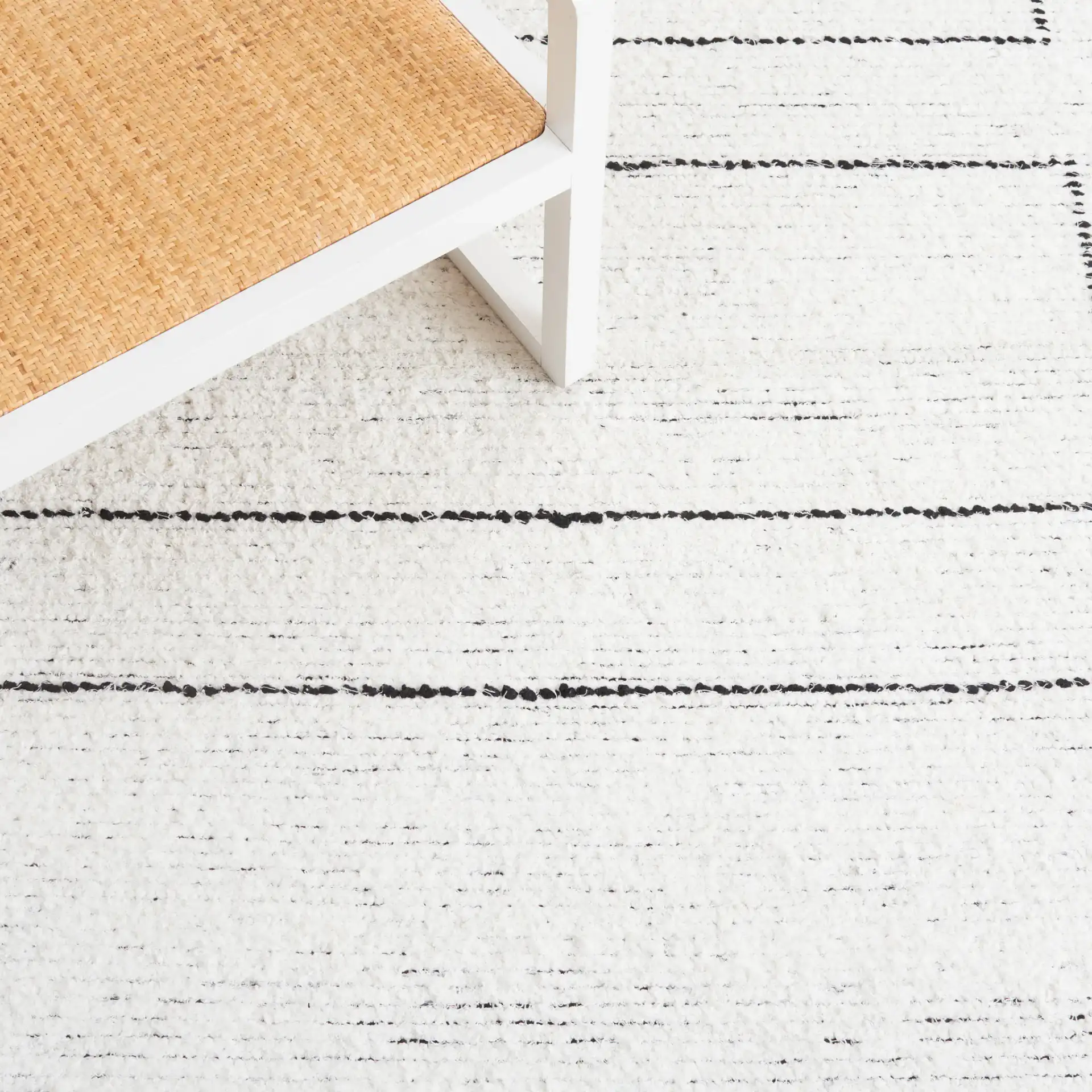 Casablanca Stacked Rectangle Hand-Woven Cotton Rug in Ivory / Black in a styled room