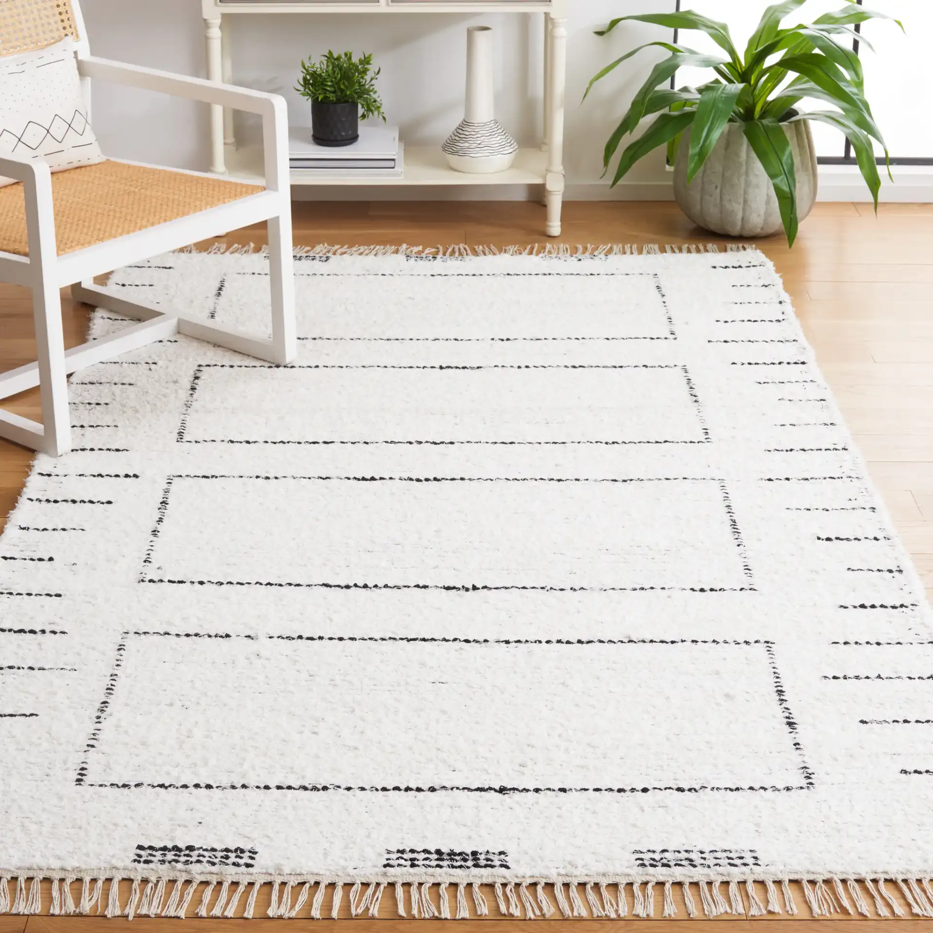 Casablanca Stacked Rectangle Hand-Woven Cotton Rug in Ivory / Black in a styled room