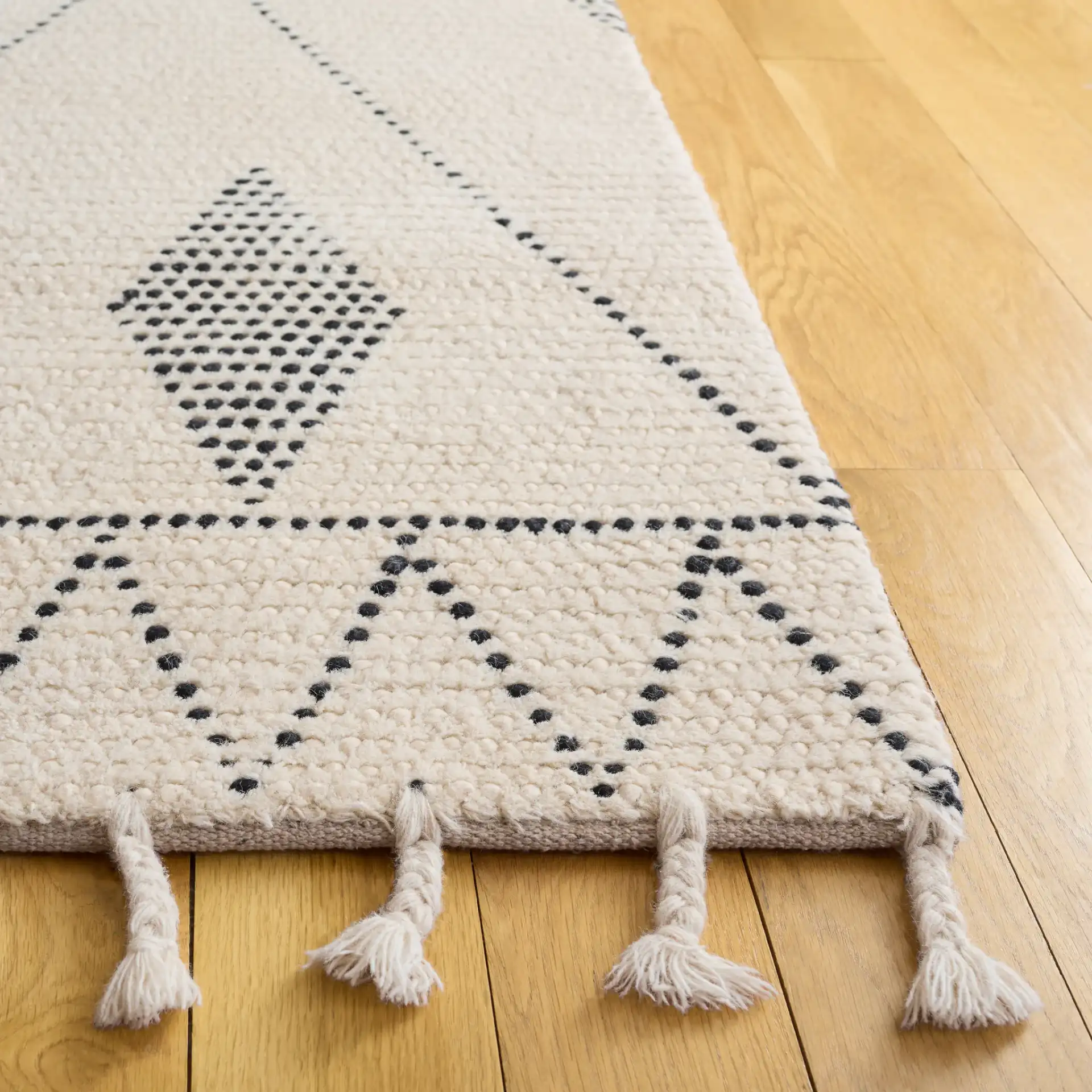 Casablanca Moroccan Tribal Hand-Woven Wool Rug in Ivory / Black in a styled room