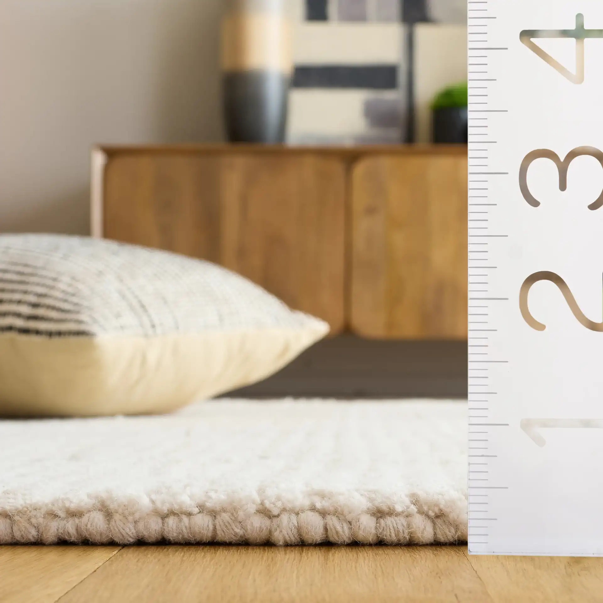 Casablanca Moroccan Tribal Hand-Woven Wool Rug in Ivory / Black in a styled room