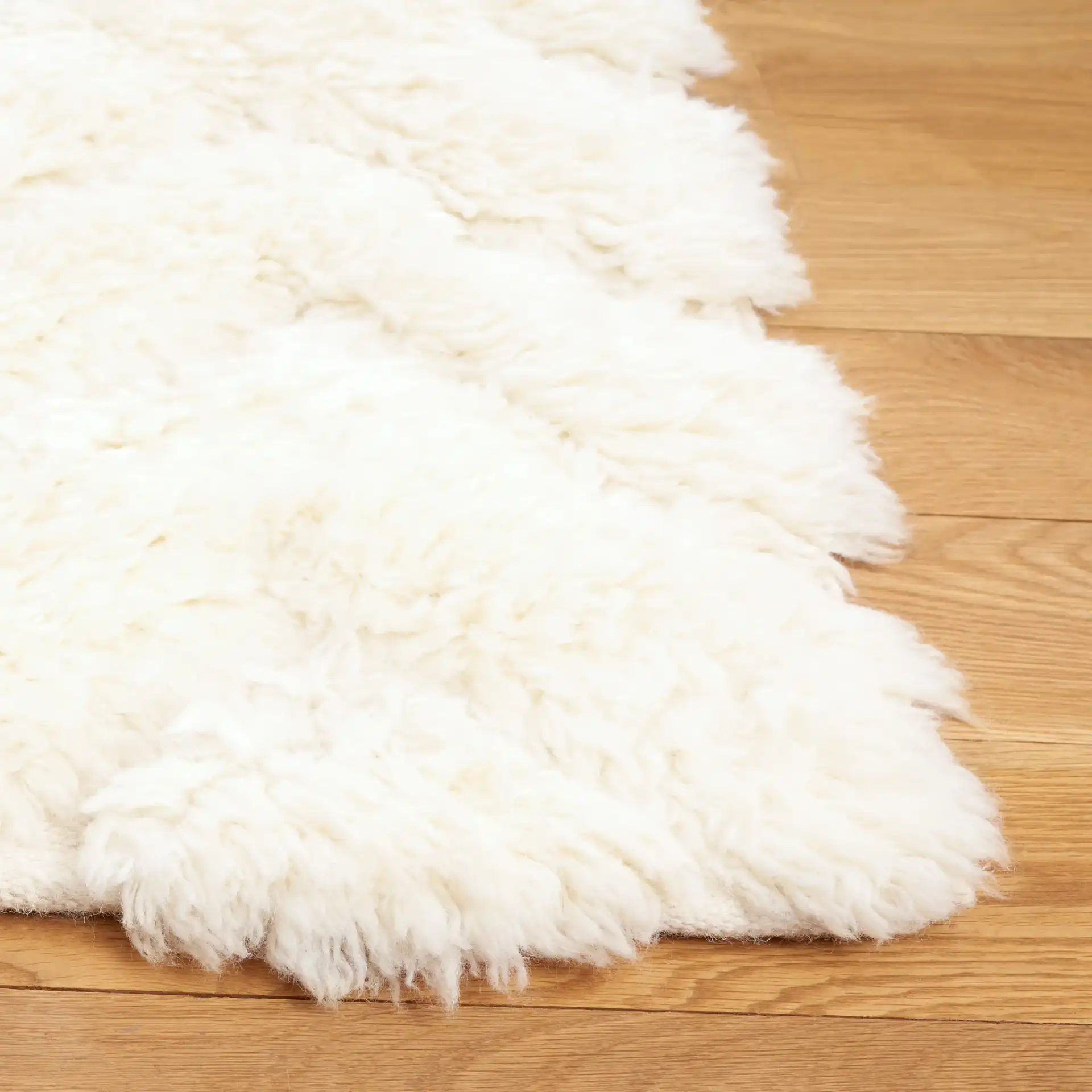Casablanca Nested Diamond Shag Wool Rug in Ivory in a styled room