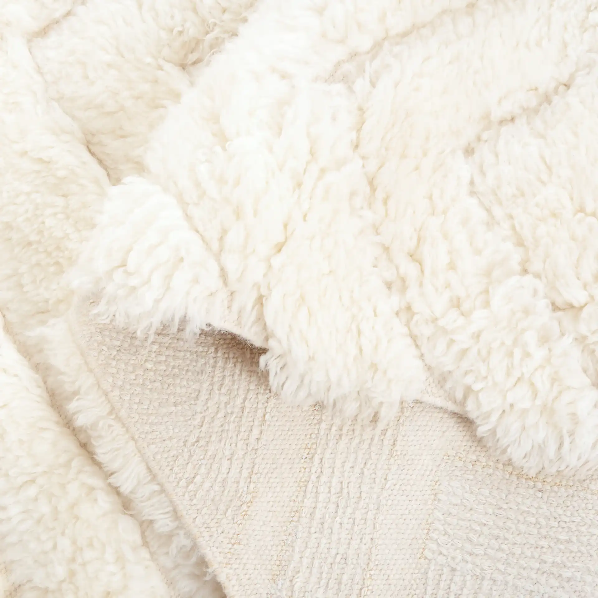 Casablanca Nested Diamond Shag Wool Rug in Ivory in a styled room