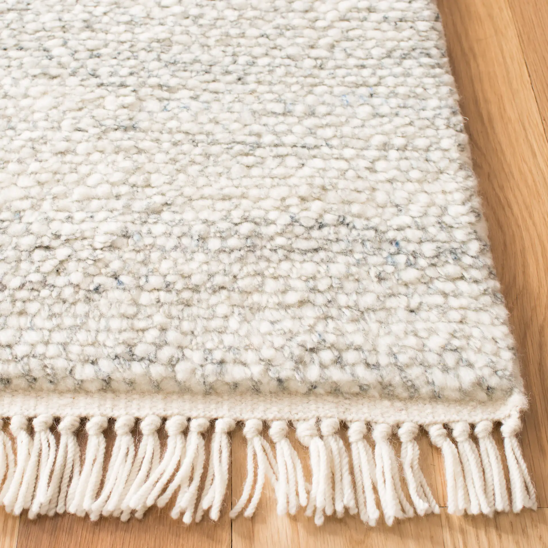 Casablanca Textured Solid Hand-Knotted Wool Rug in Gray in a styled room