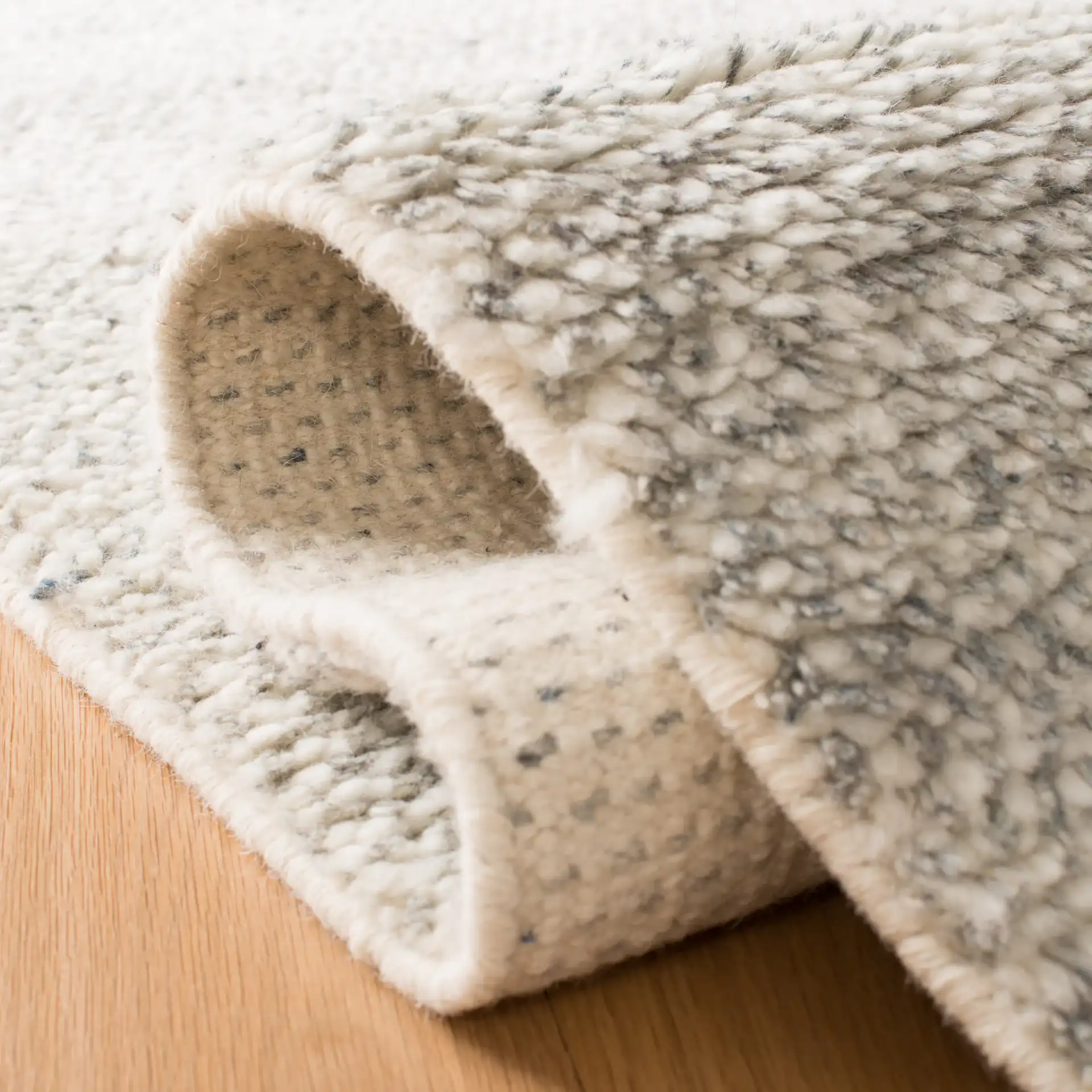 Casablanca Textured Solid Hand-Knotted Wool Rug in Gray in a styled room