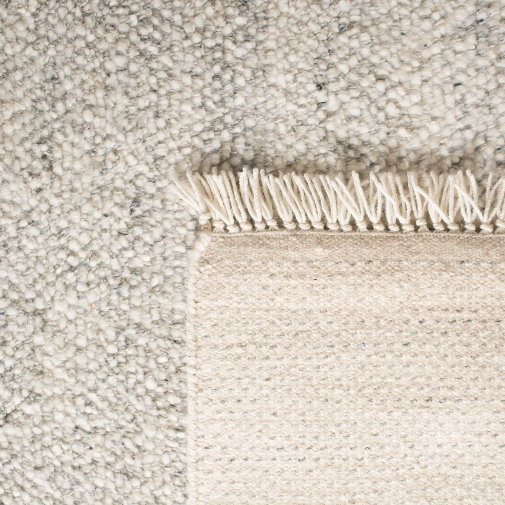 Casablanca Textured Solid Hand-Knotted Wool Rug in Gray in a styled room