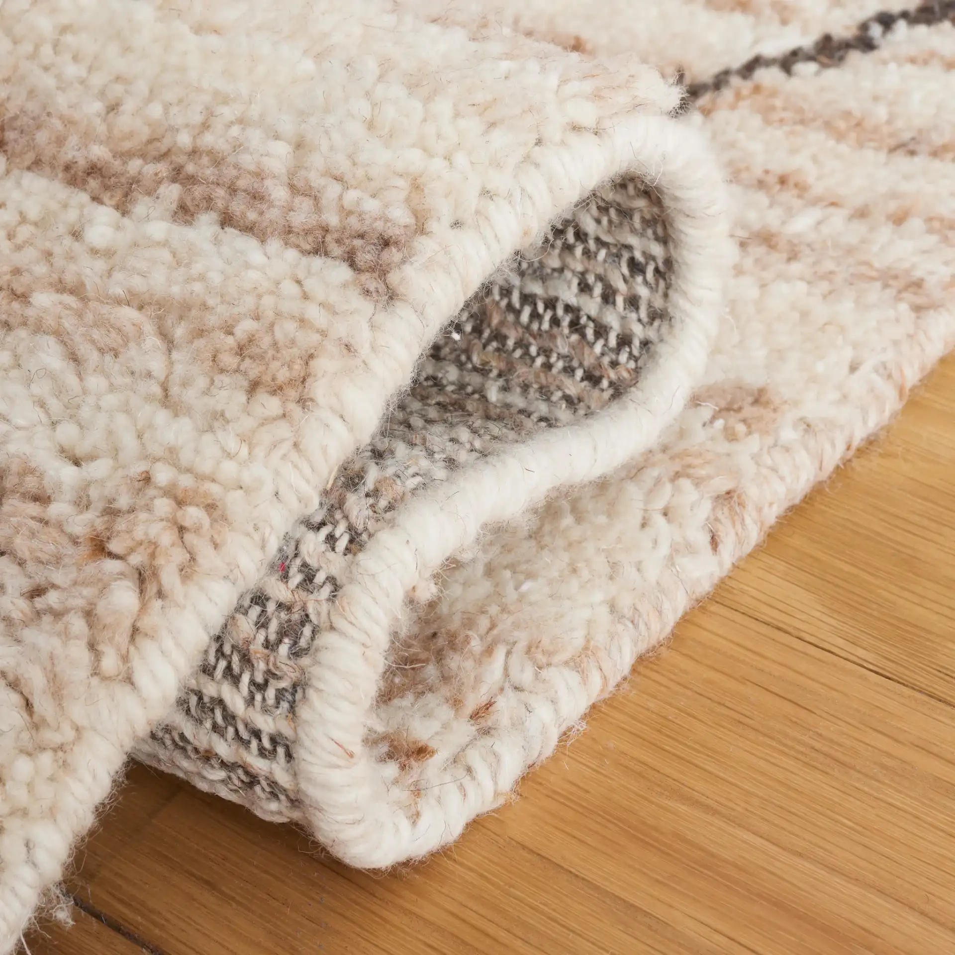 Casablanca Diamond Trellis Hand-Woven Wool Rug in Beige in a styled room