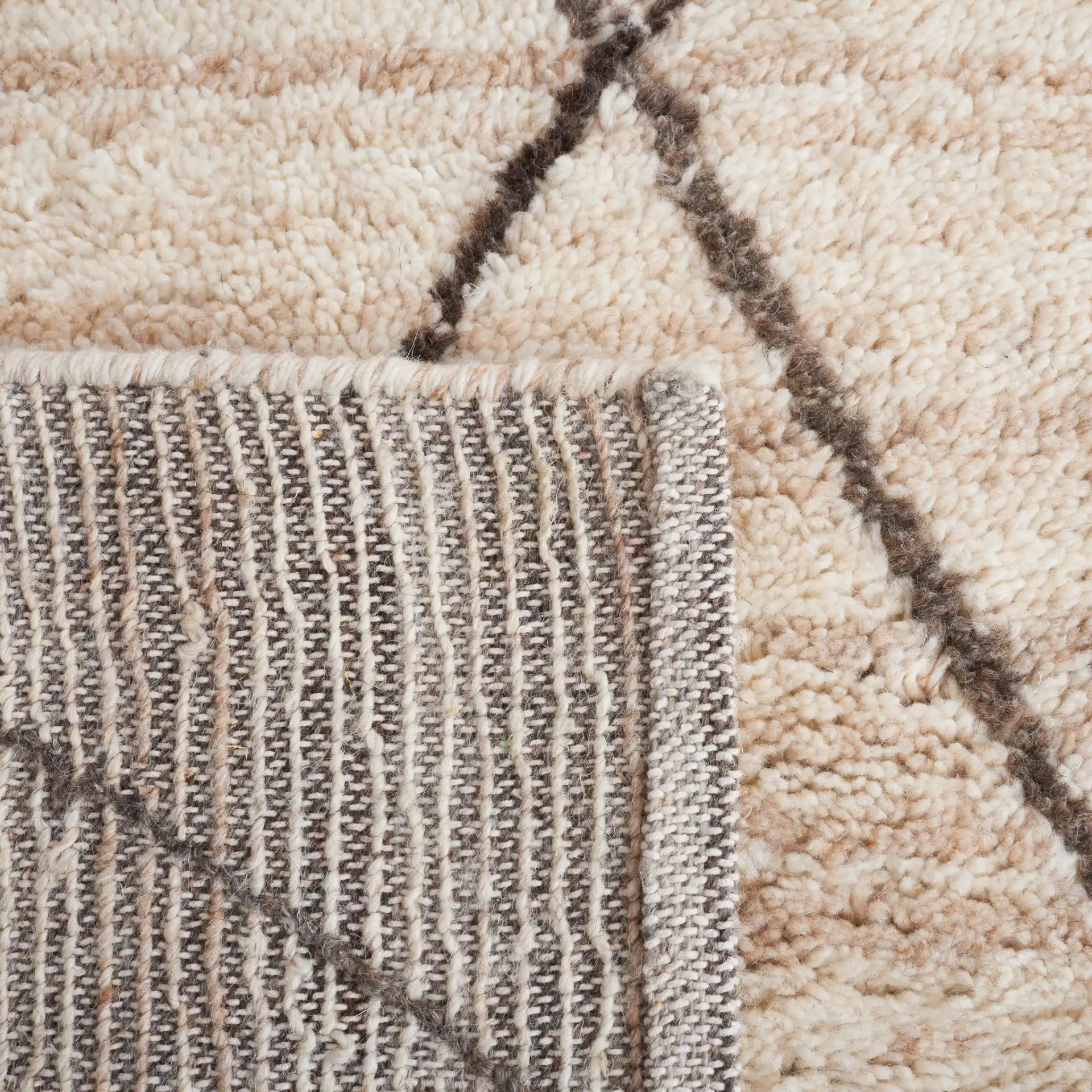 Casablanca Diamond Trellis Hand-Woven Wool Rug in Beige in a styled room
