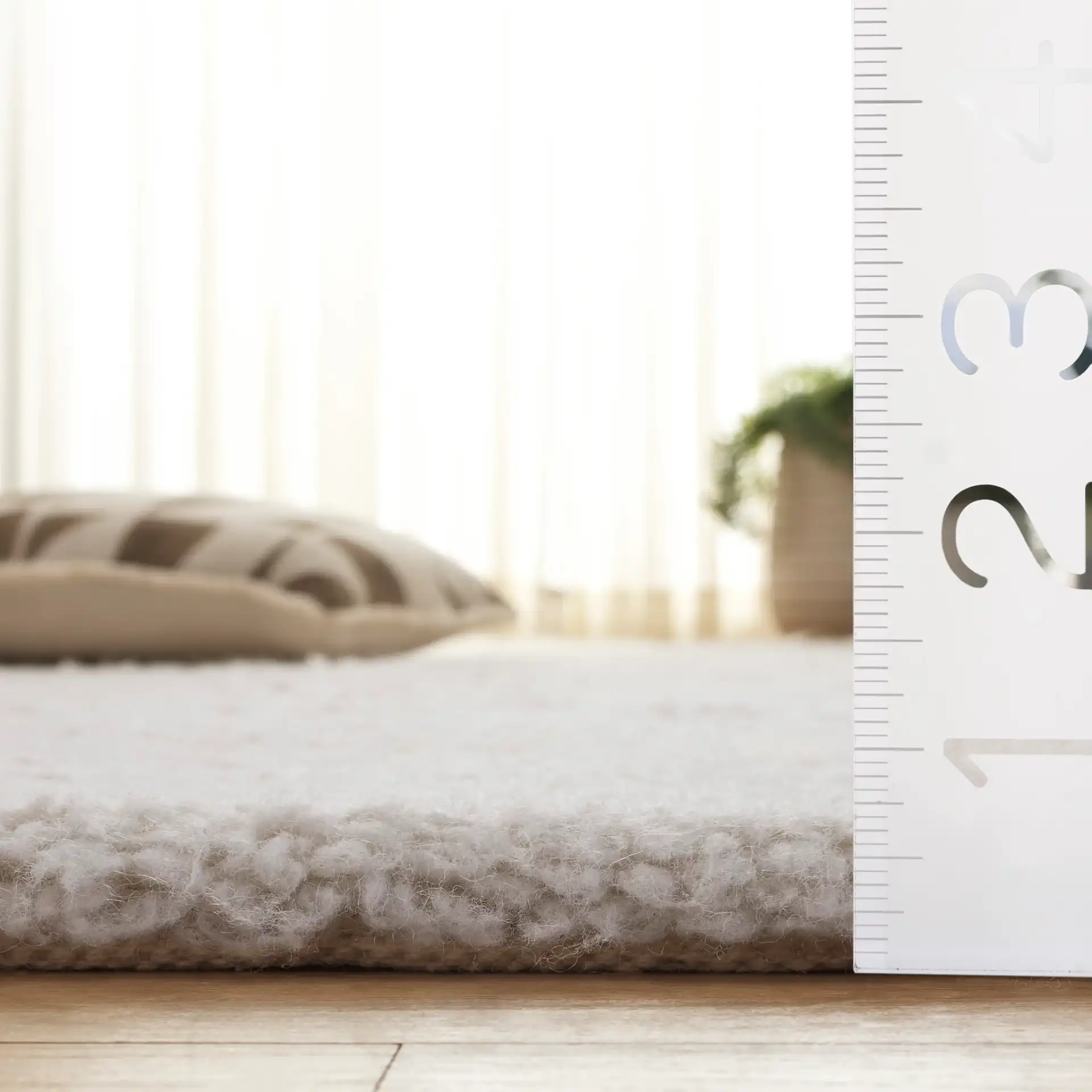 Casablanca Solid Hand-Loomed Wool Shag Rug in Ivory in a styled room