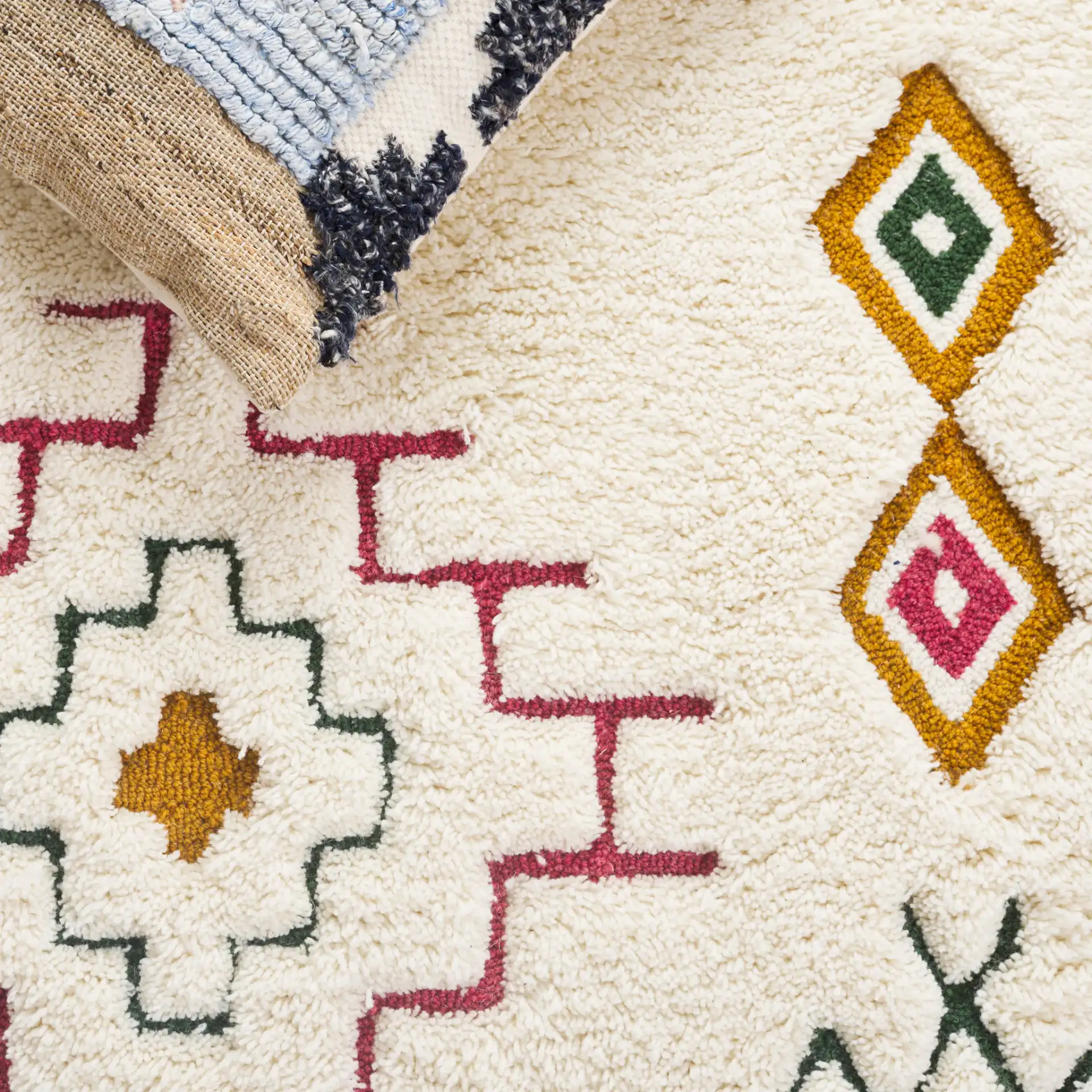 Casablanca Tribal Motif Hand-Tufted Shag Wool Rug in Ivory / Pink in a styled room