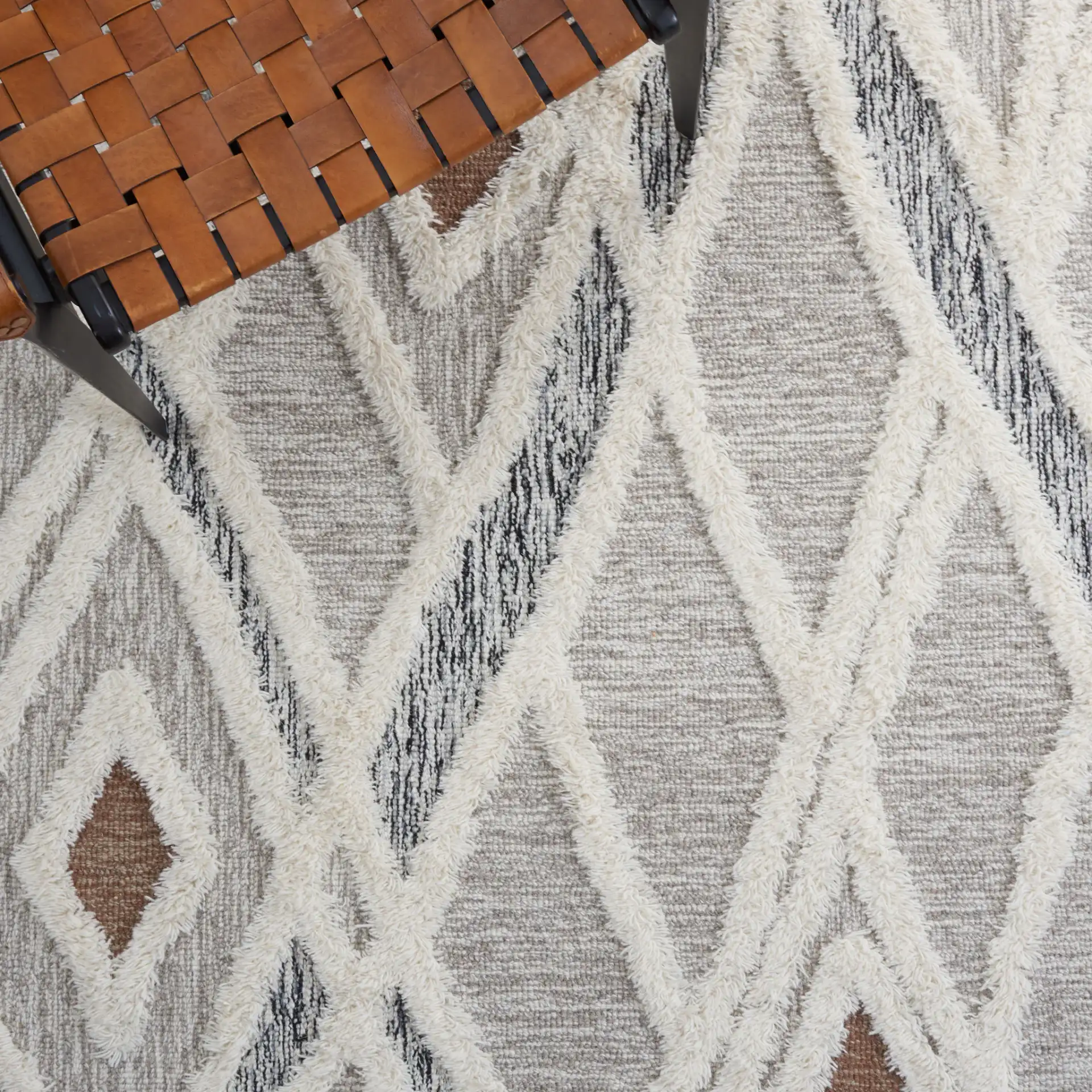 Casablanca Tribal Diamond Hand-Tufted Shag Wool Rug in Gray / Ivory in a styled room