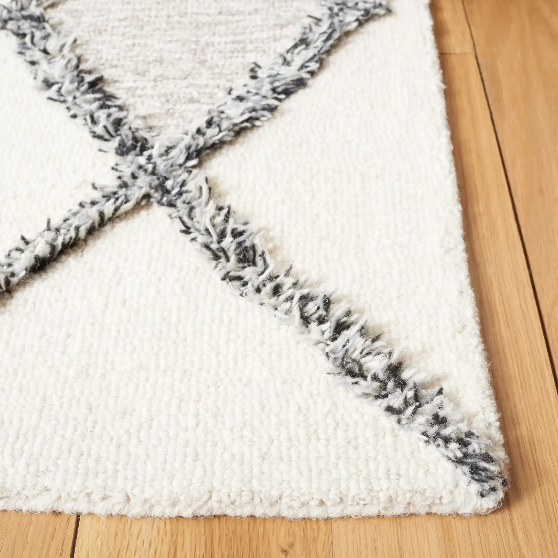 Casablanca Stacked Diamond Hand-Tufted Wool Rug in Ivory / Black in a styled room