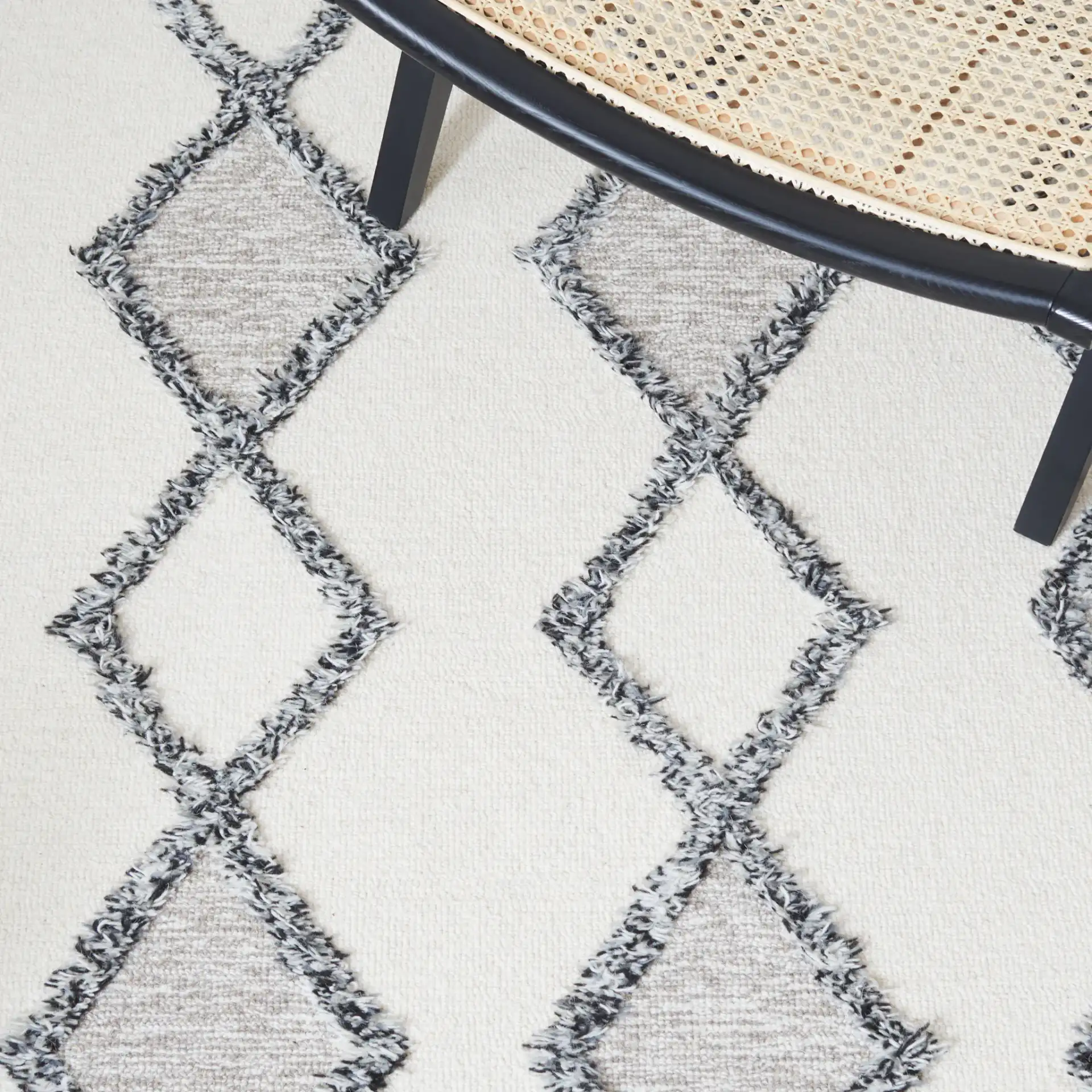 Casablanca Stacked Diamond Hand-Tufted Wool Rug in Ivory / Black in a styled room