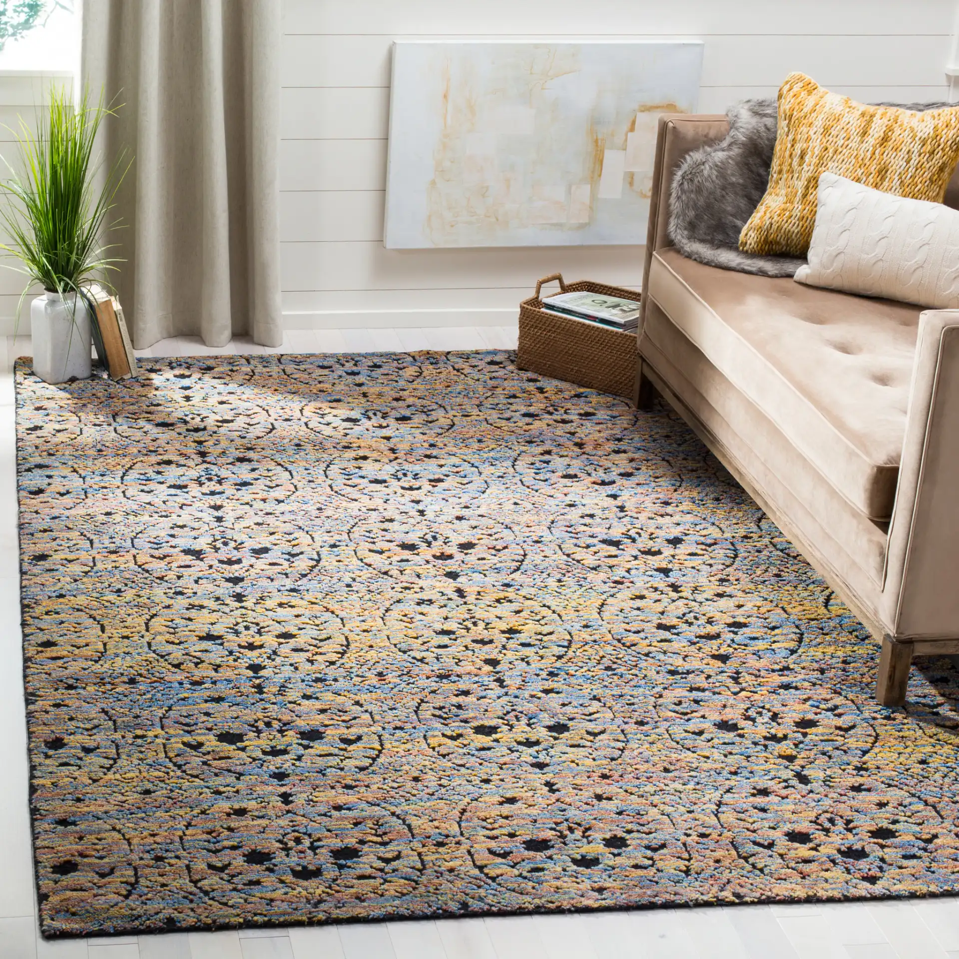 Castilla Repeating Medallion Hand-Knotted Wool Rug in Blue Gold / Charcoal in a styled room