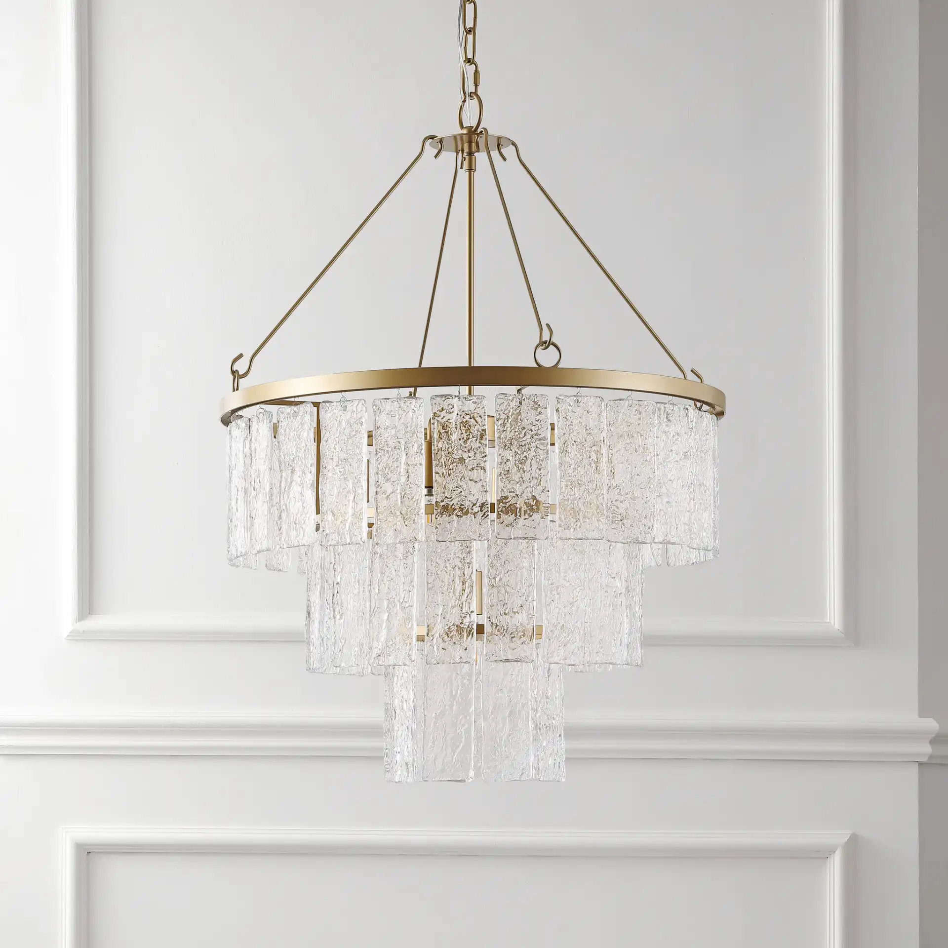 Marjory Three-Tier Chandelier in Gold in a styled room