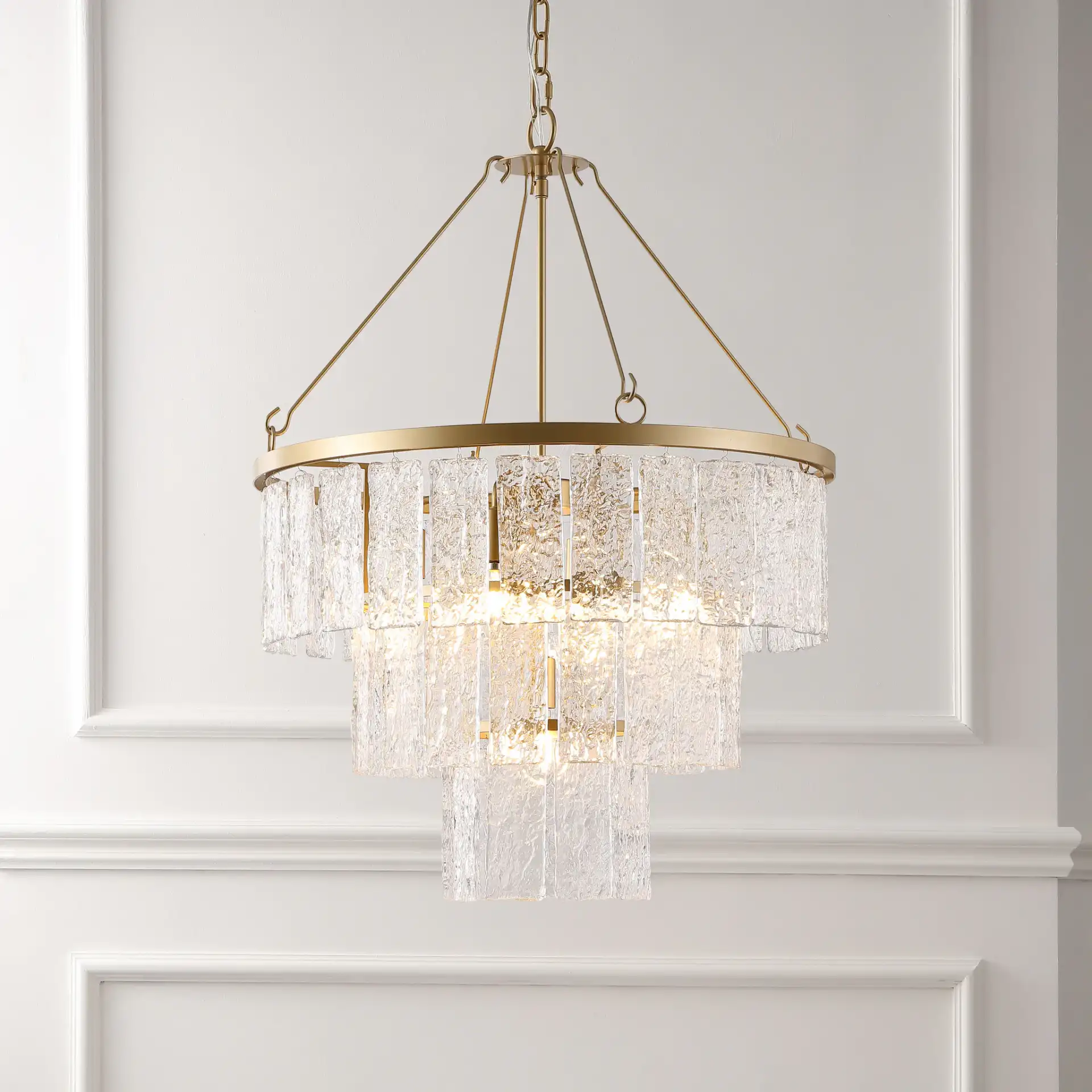 Marjory Three-Tier Chandelier in Gold in a styled room