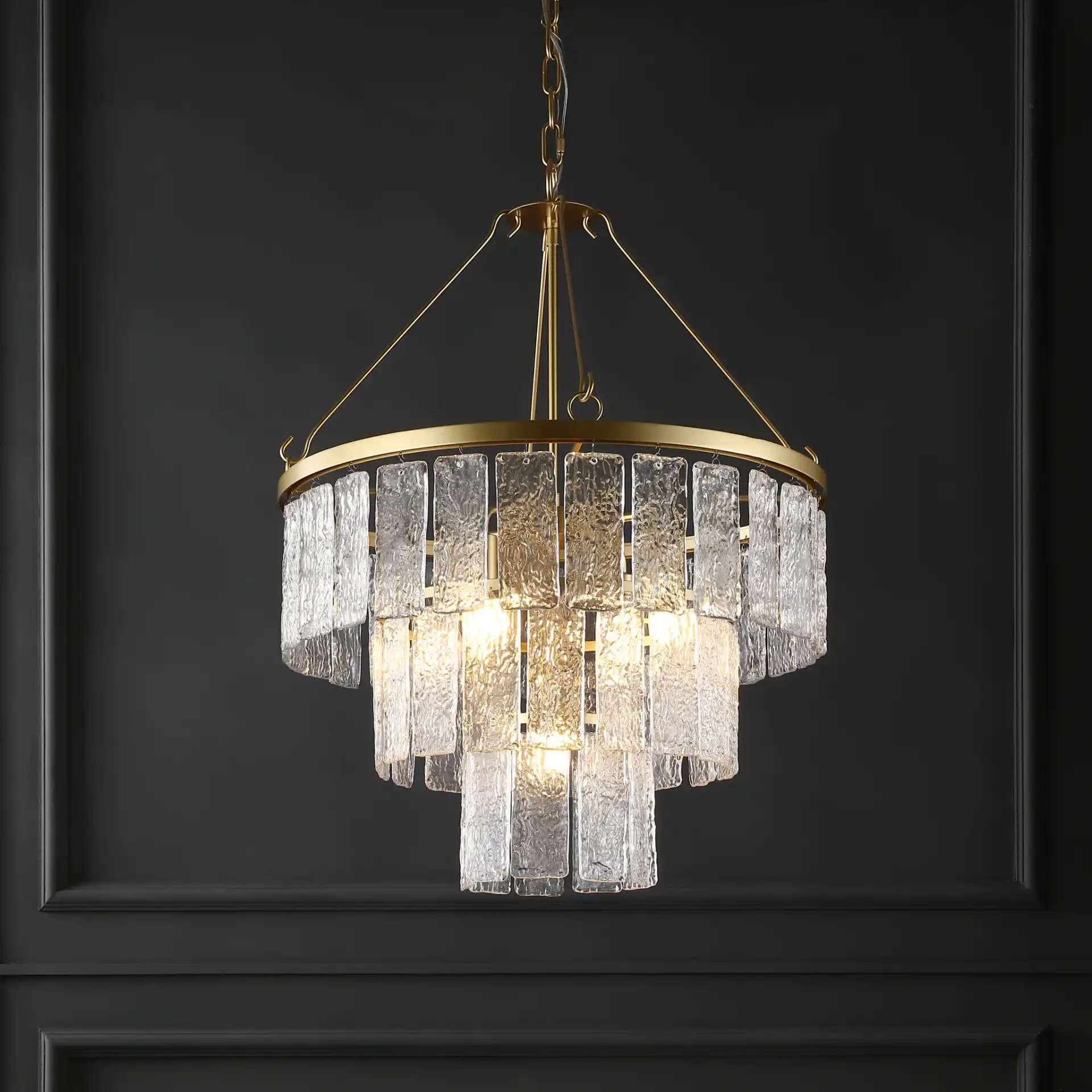 Marjory Three-Tier Chandelier in Gold in a styled room