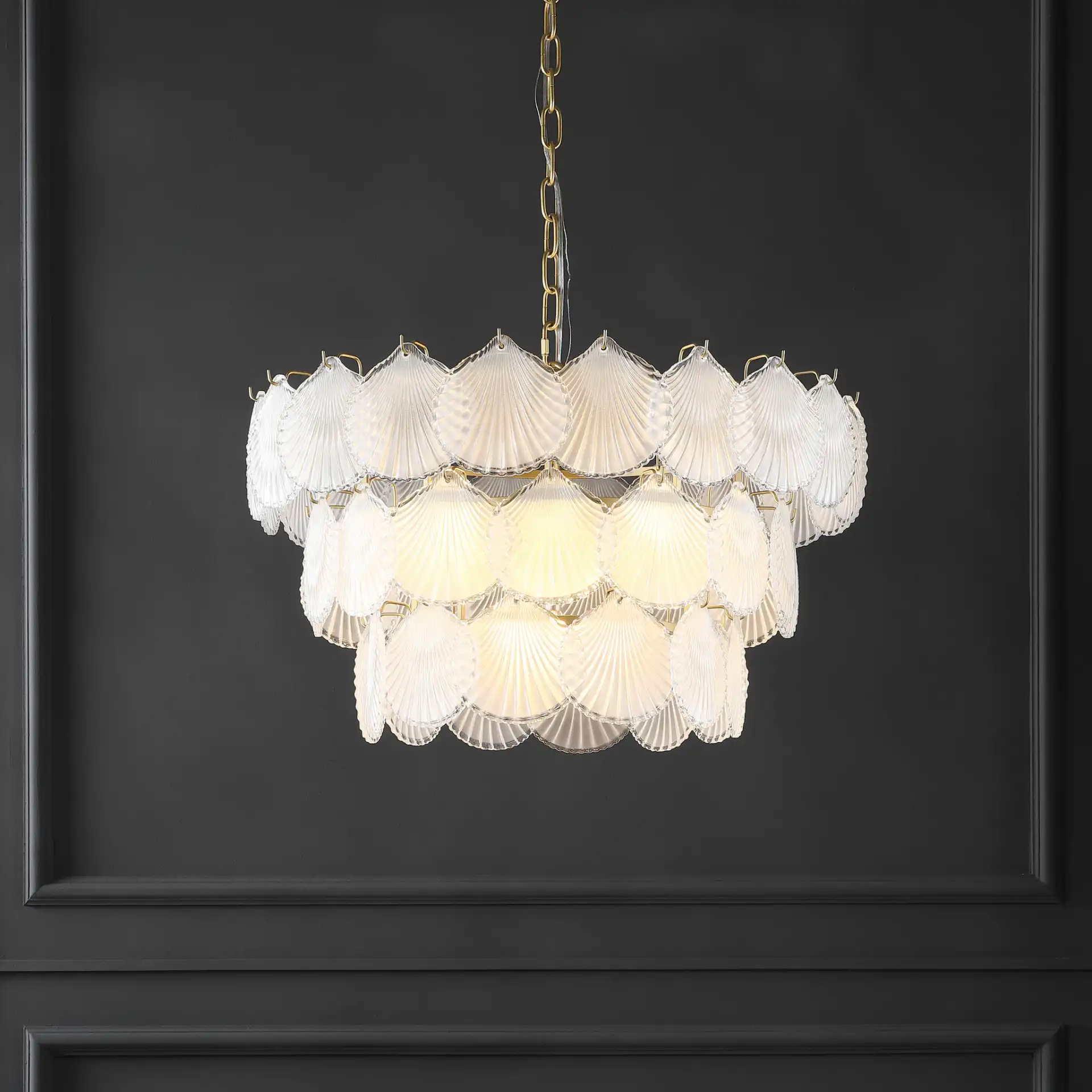 Gutierrez Three-Tier Glass Chandelier in Gold in a styled room