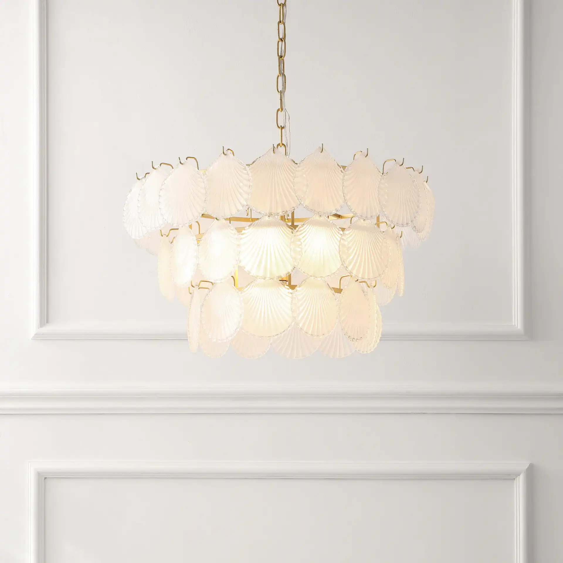 Gutierrez Three-Tier Glass Chandelier in Gold in a styled room