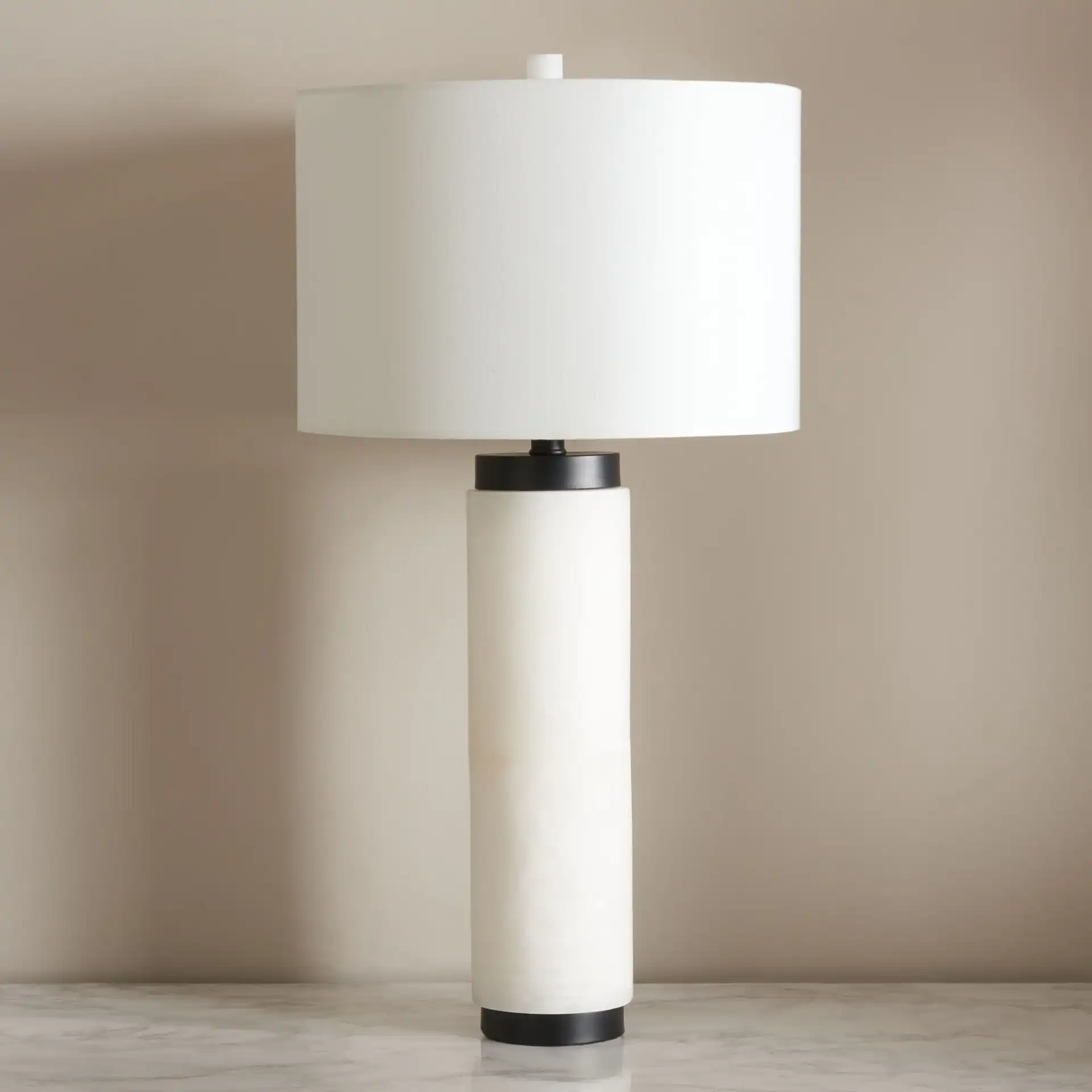 Sydni Alabaster Pillar Table Lamp in White in a styled room
