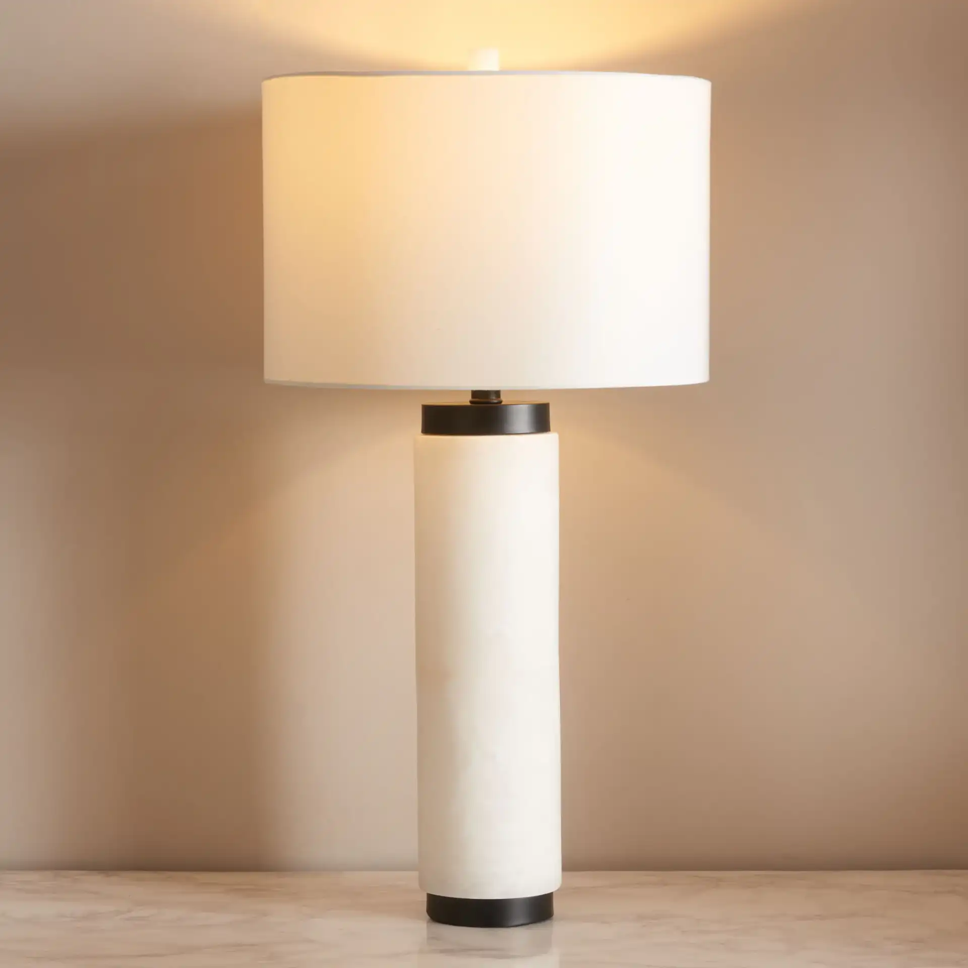 Sydni Alabaster Pillar Table Lamp in White in a styled room