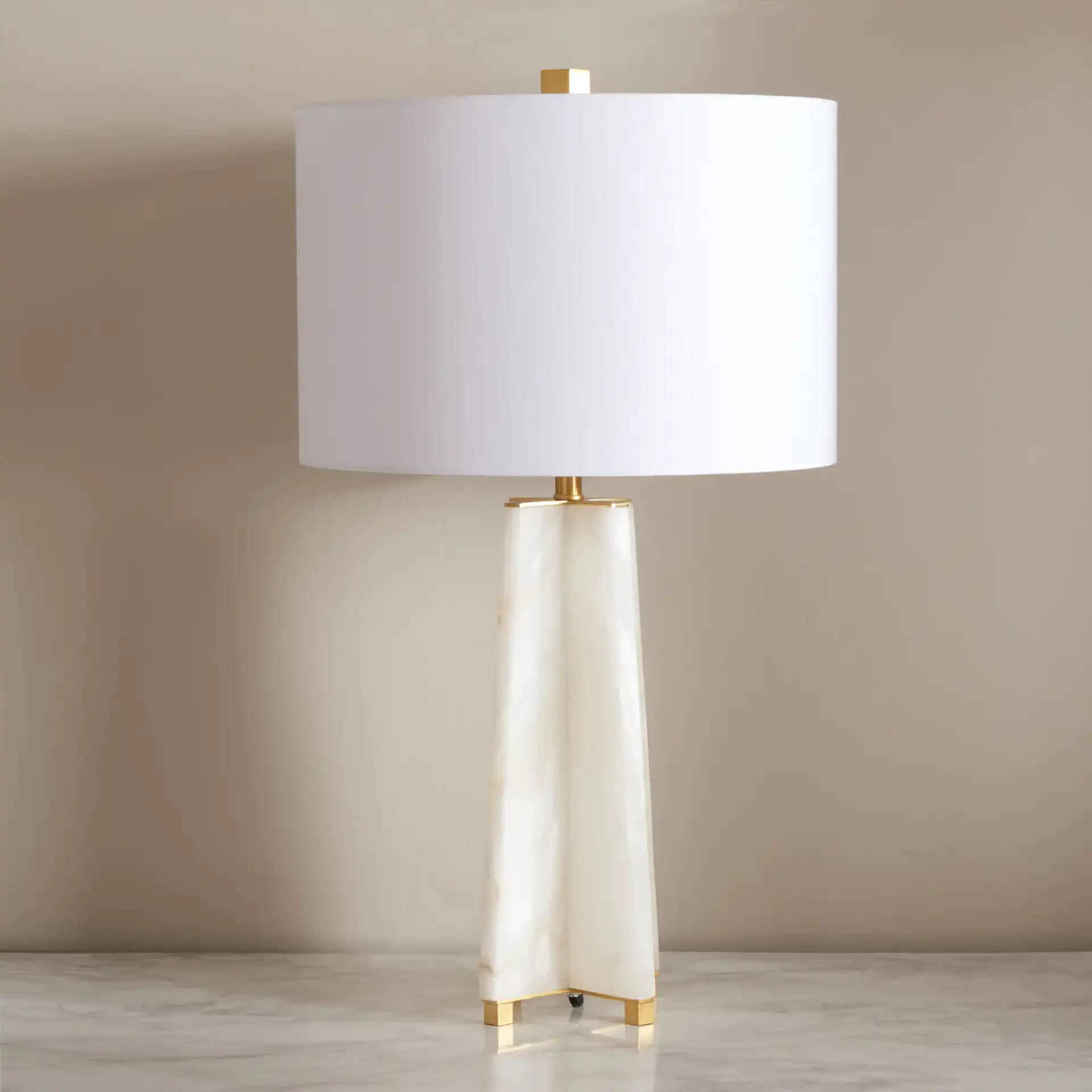Gracellen Alabaster Table Lamp in White / Gold in a styled room