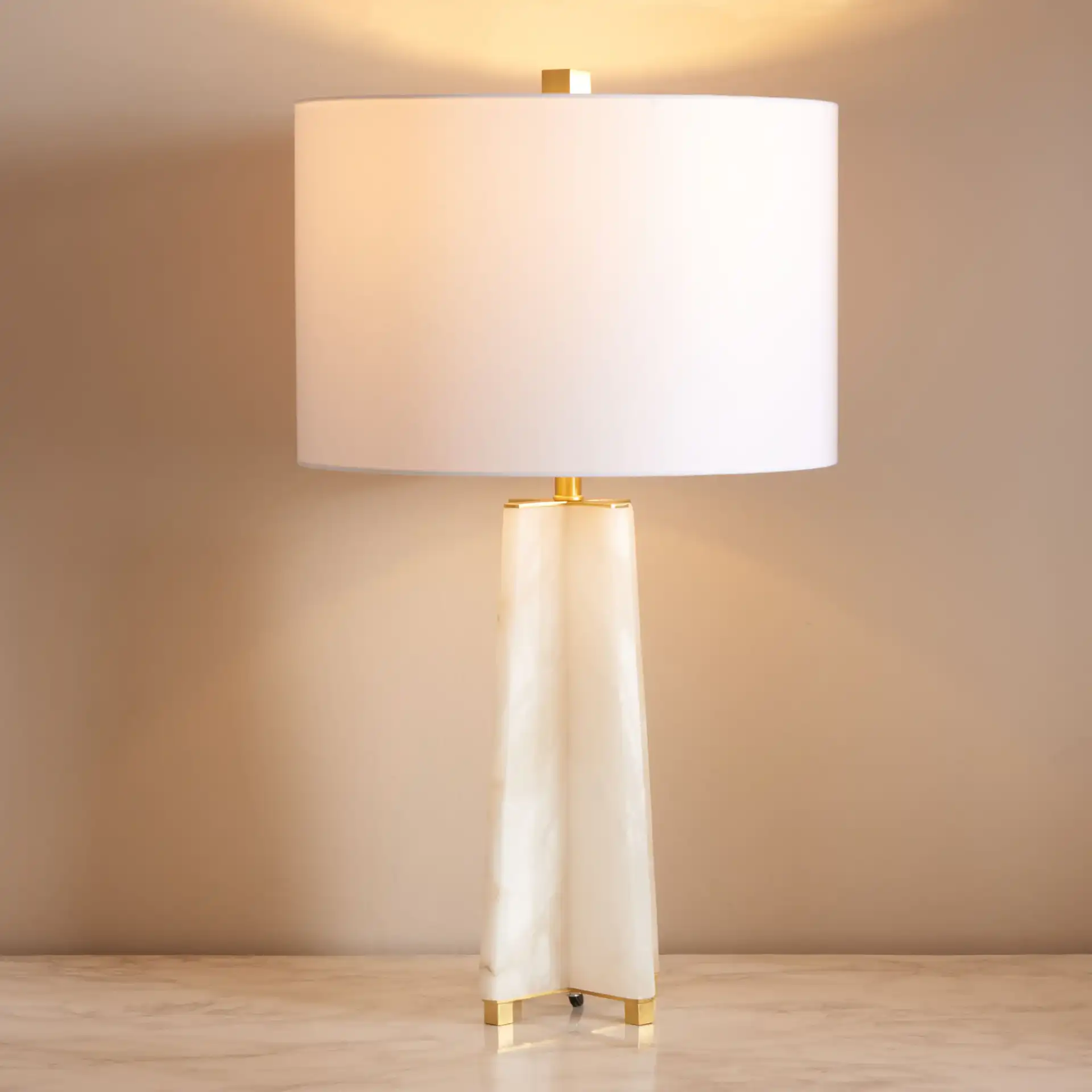 Gracellen Alabaster Table Lamp in White / Gold in a styled room