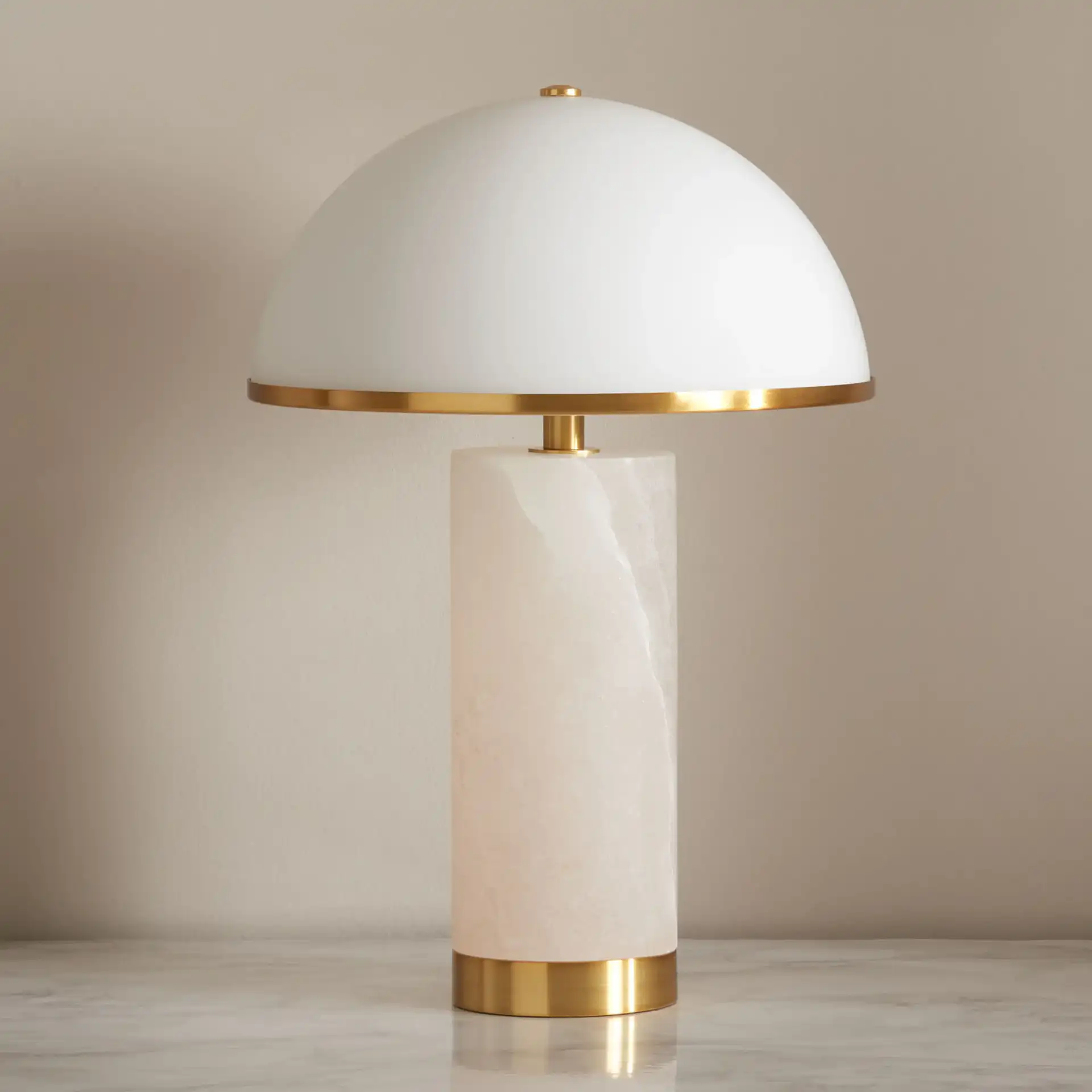 Izabel Alabaster Table Lamp in Gold / White in a styled room