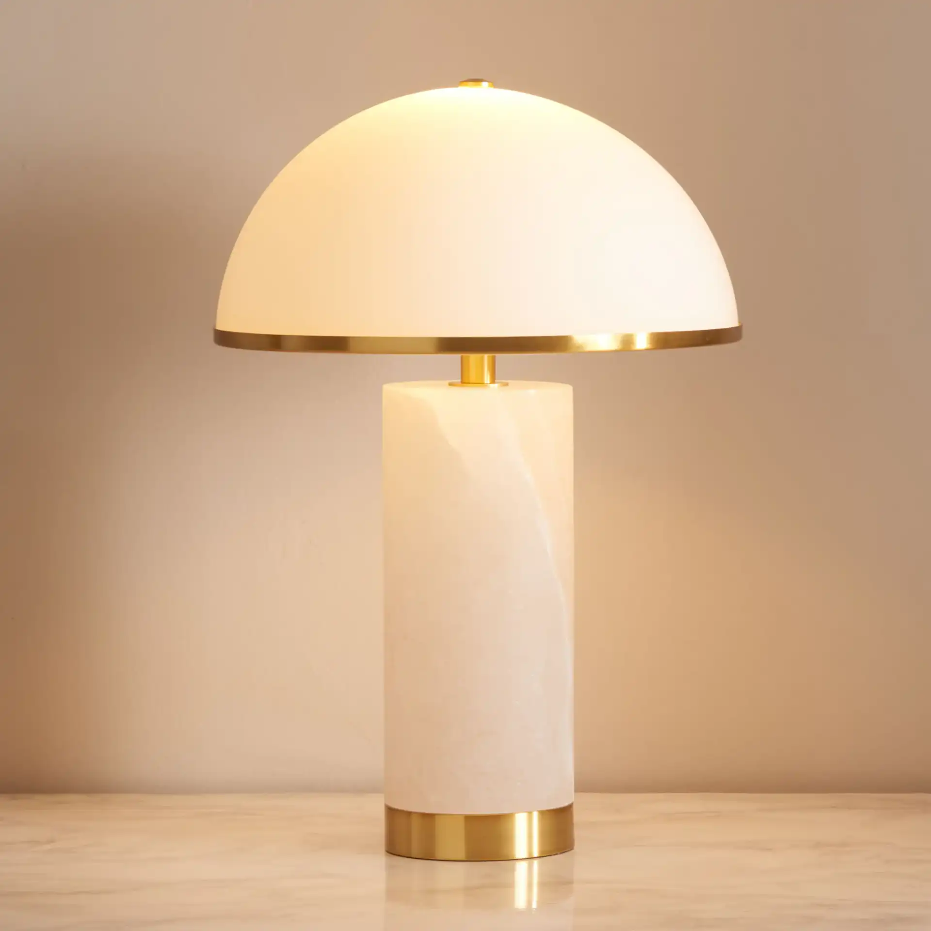 Izabel Alabaster Table Lamp in Gold / White in a styled room