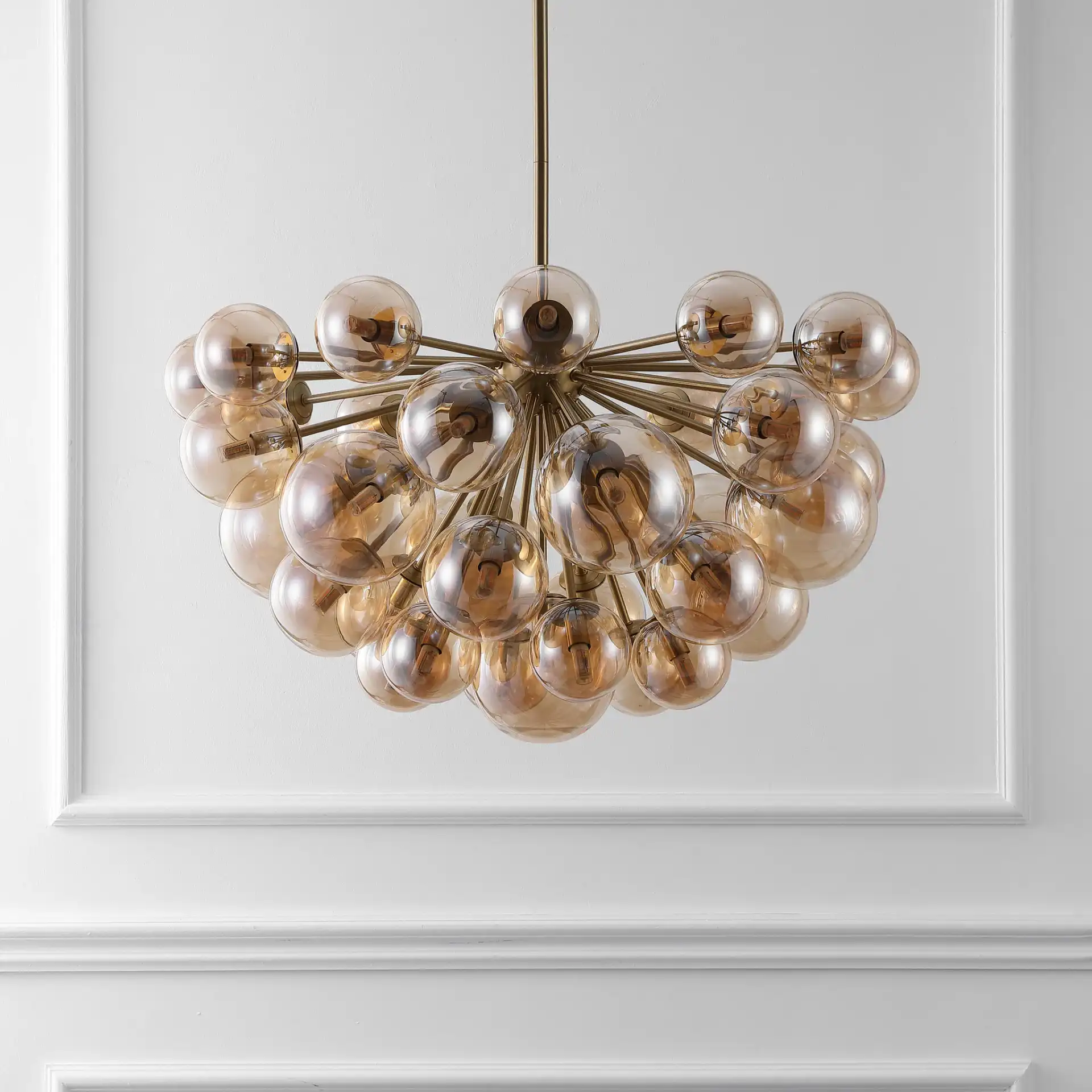 Raphaela Glass Globe Chandelier in Gold / White in a styled room