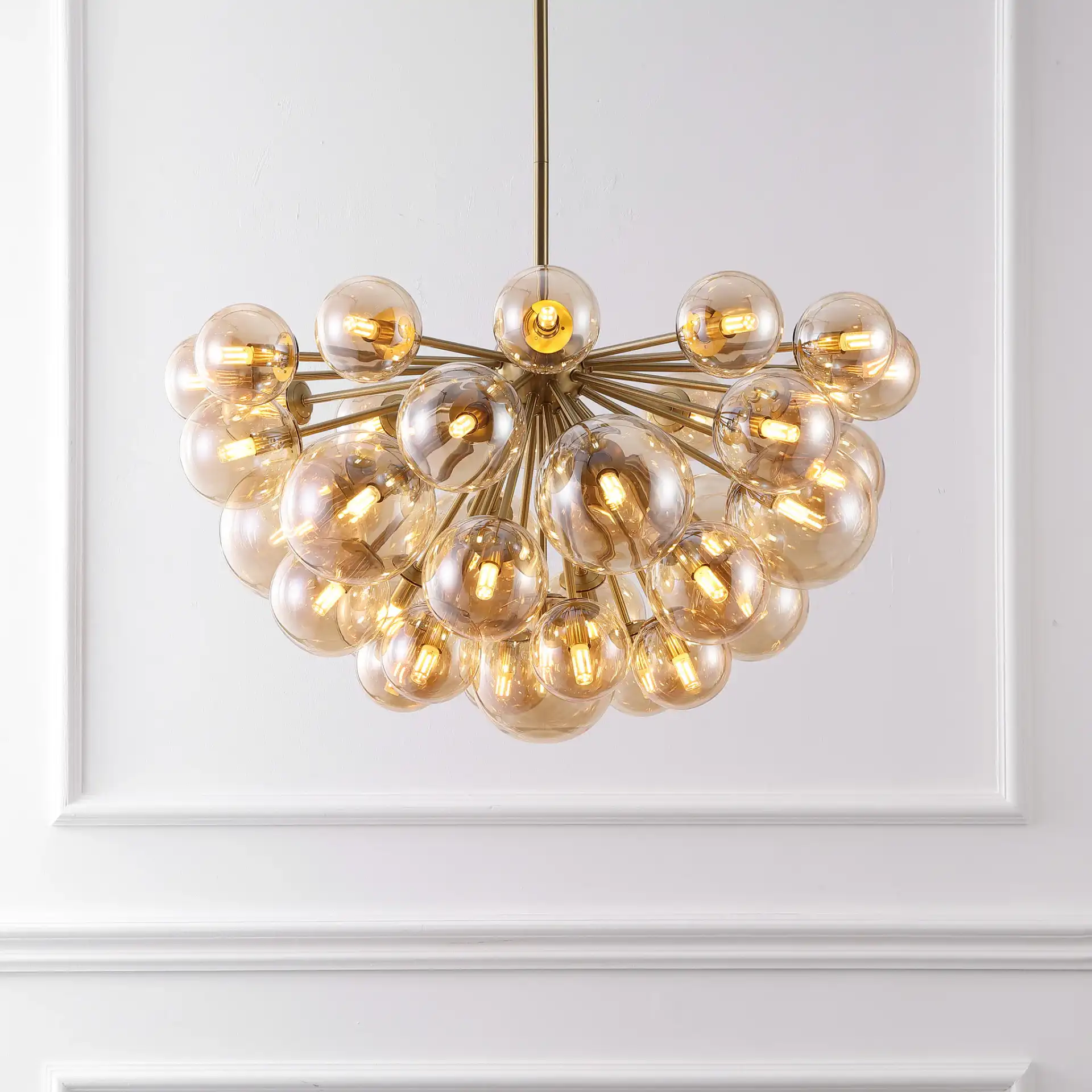 Raphaela Glass Globe Chandelier in Gold / White in a styled room