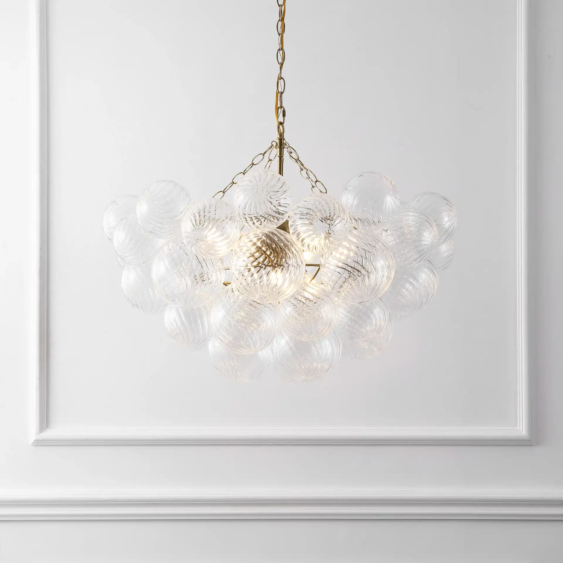 Betty Glass Bubbles Chandelier in Brass / Clear in a styled room