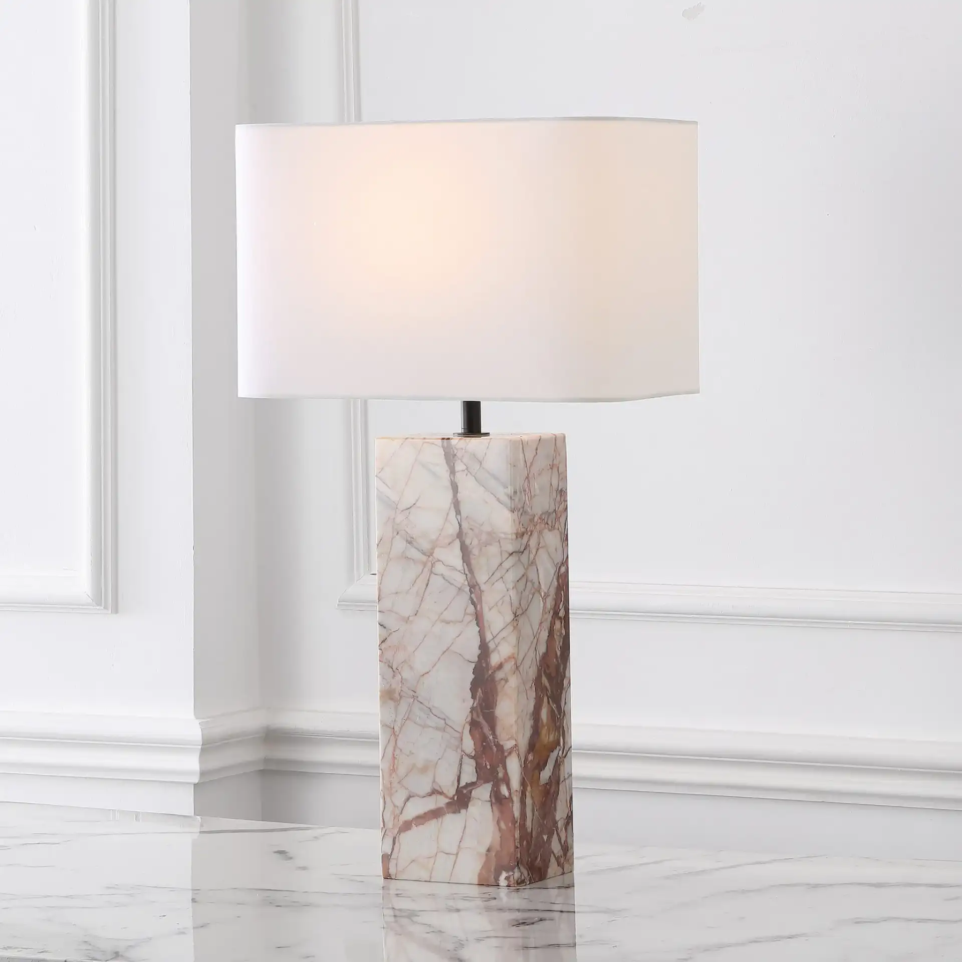 Chrisette Marble Base Table Lamp in White / Red in a styled room