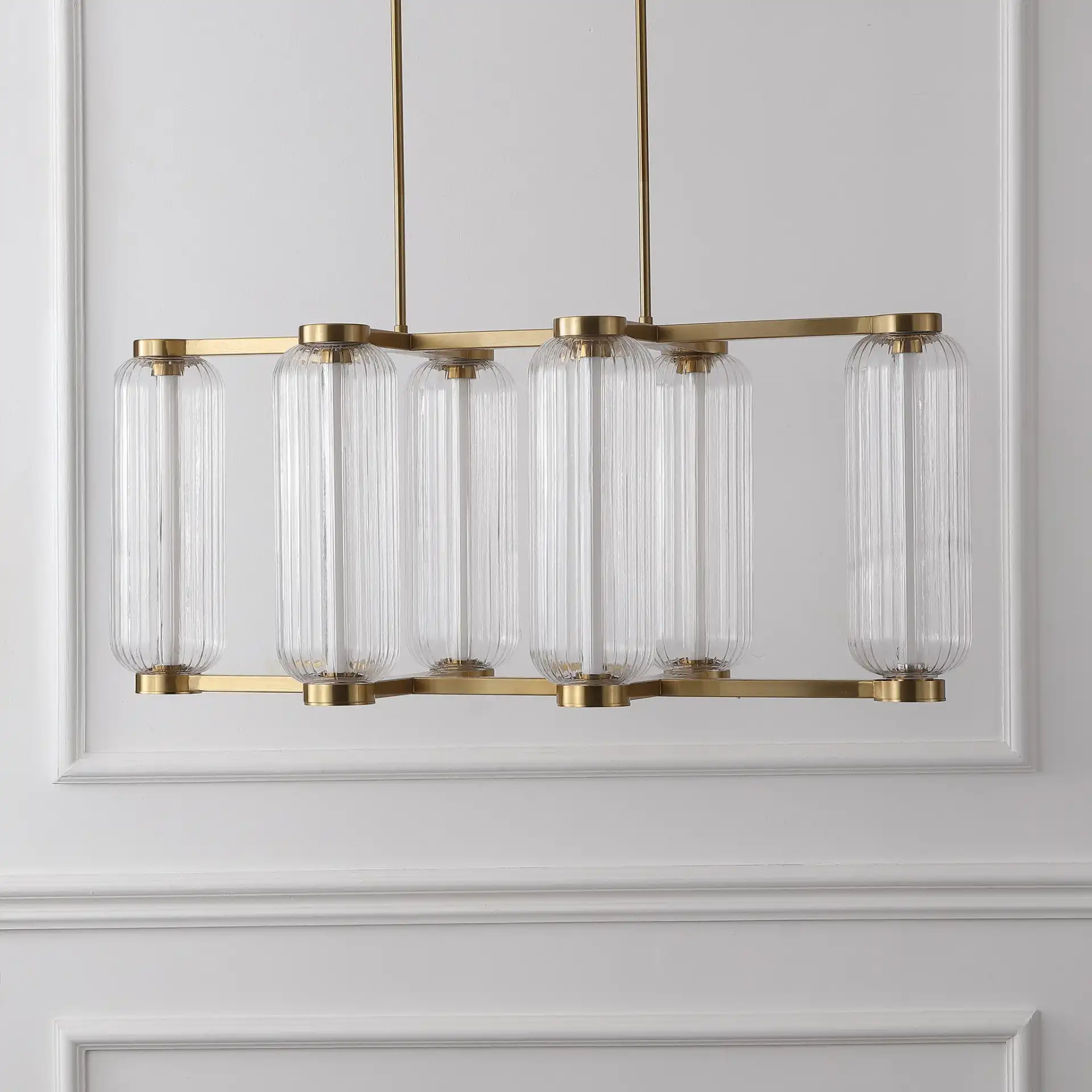 Cyndy Rectangular Glass Chandelier in Gold / Clear in a styled room
