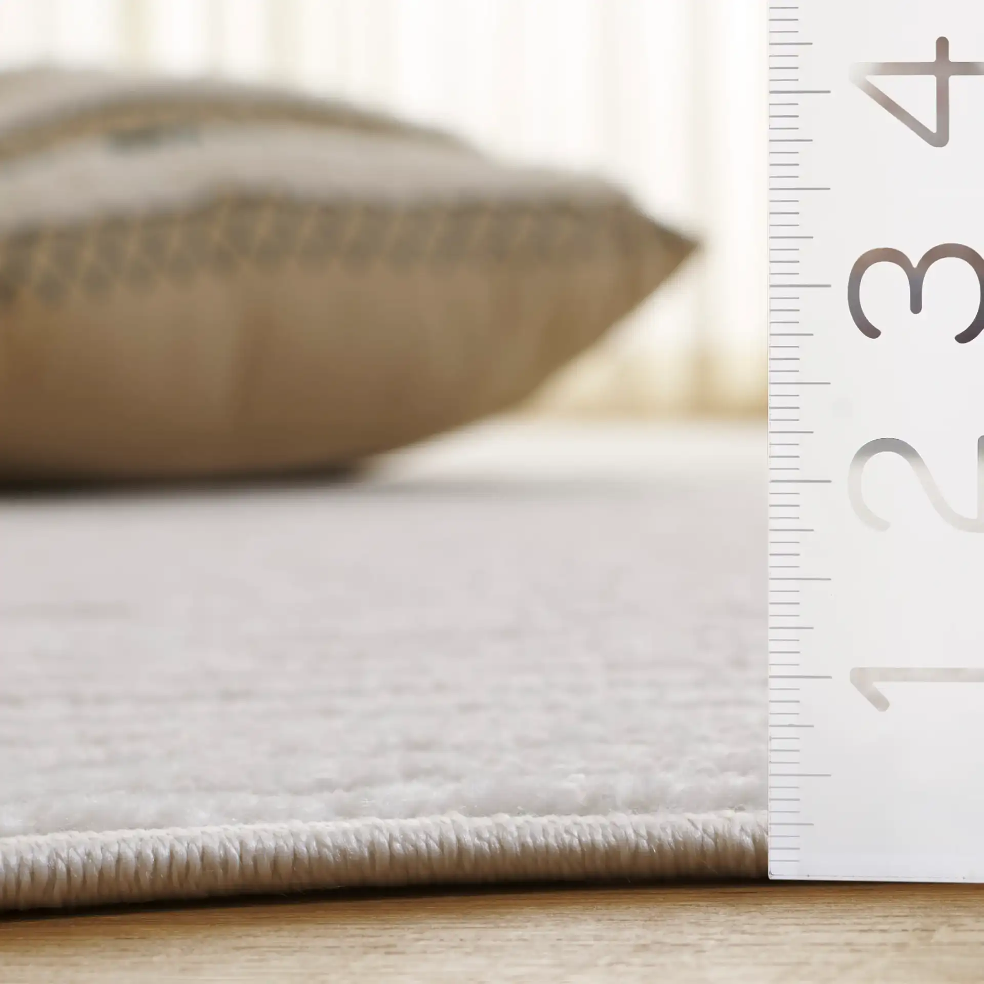 Contour Wavy Ribbed Rug in Ivory in a styled room