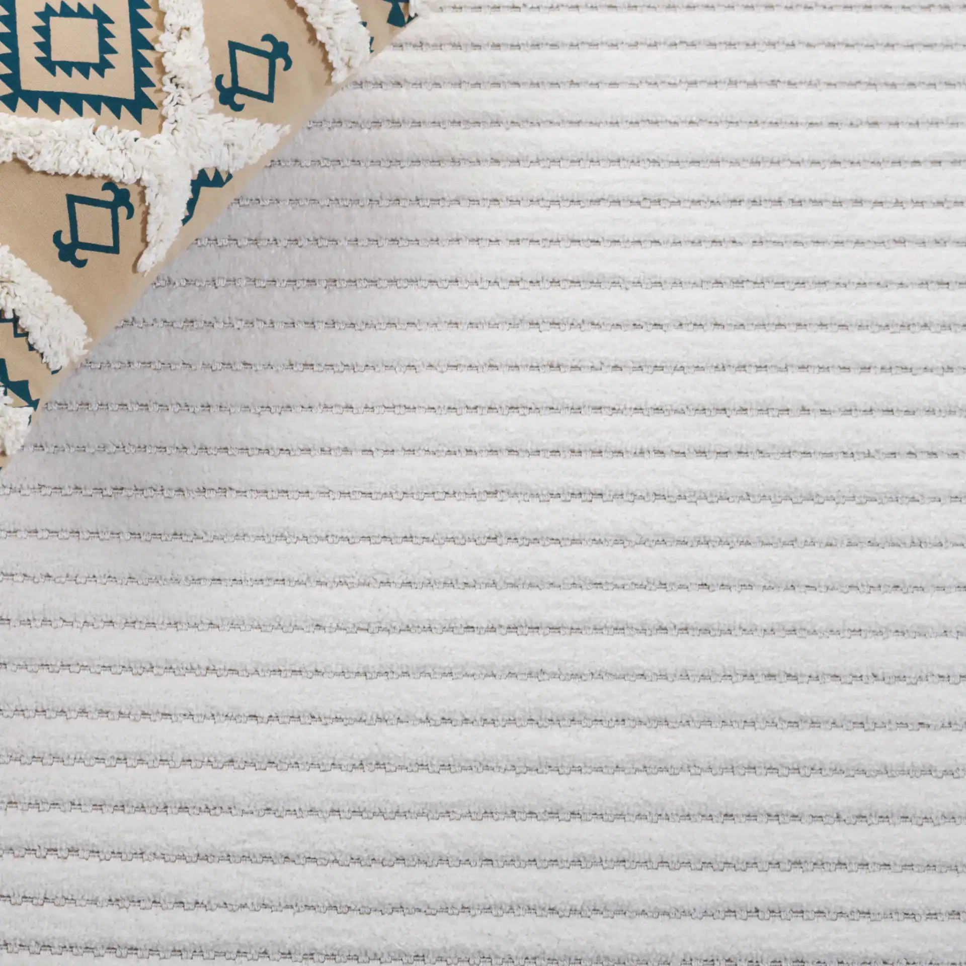 Contour Wavy Ribbed Rug in Ivory in a styled room