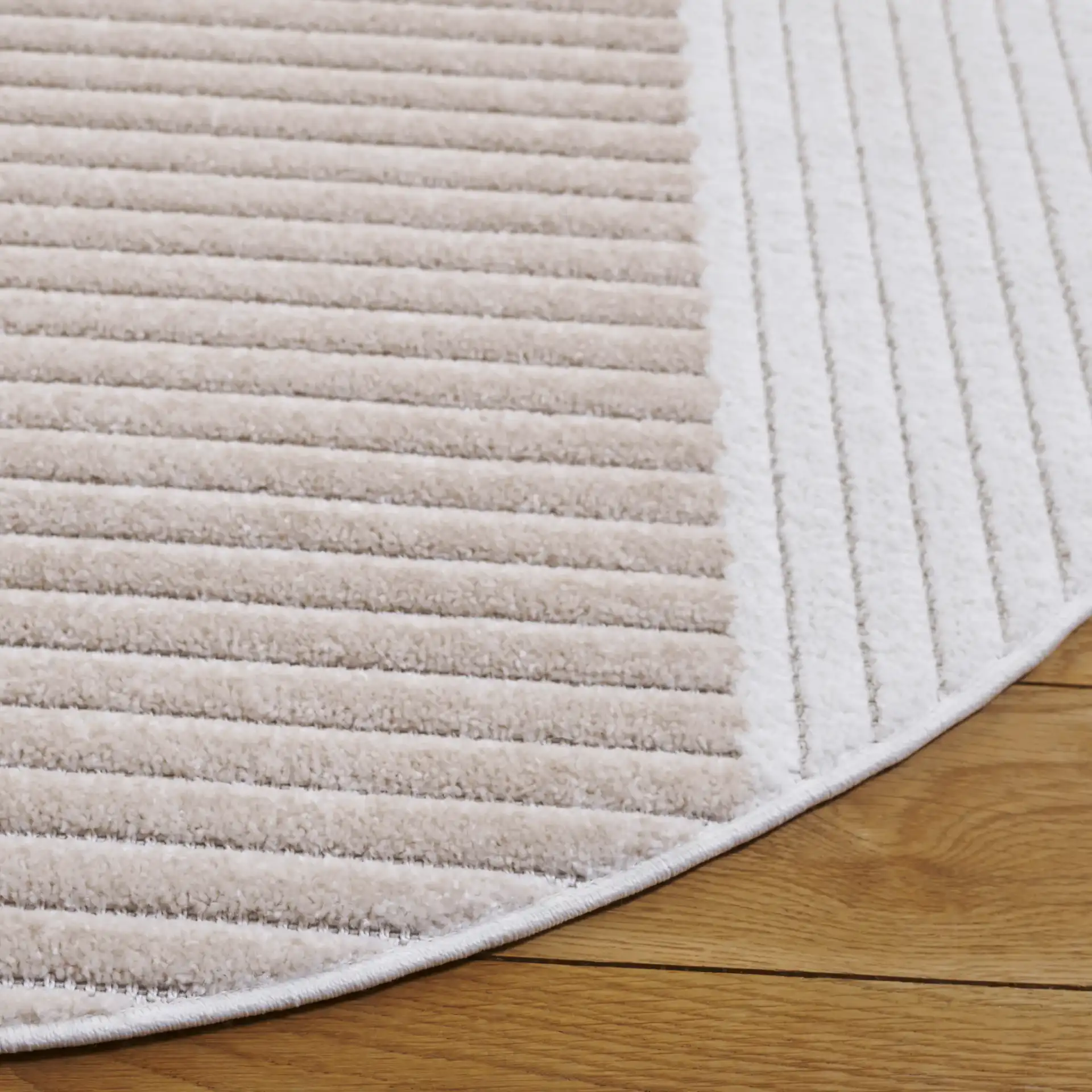 Contour Curved Block Rug in Ivory / Beige in a styled room