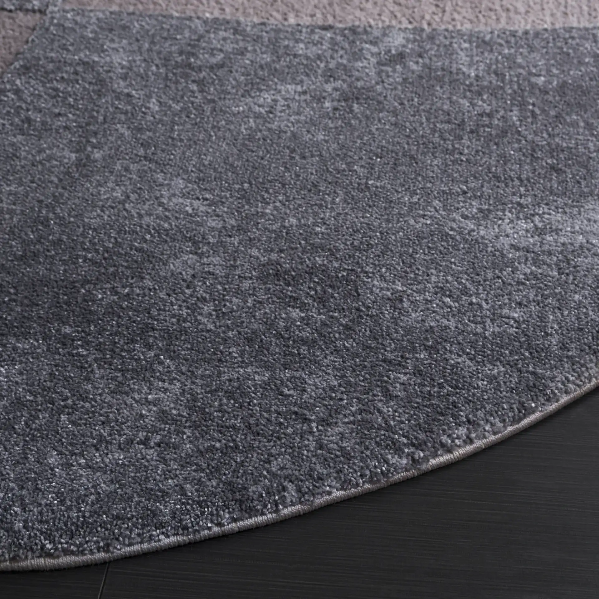 Contour Curved Abstract Rug in Gray / Ivory in a styled room