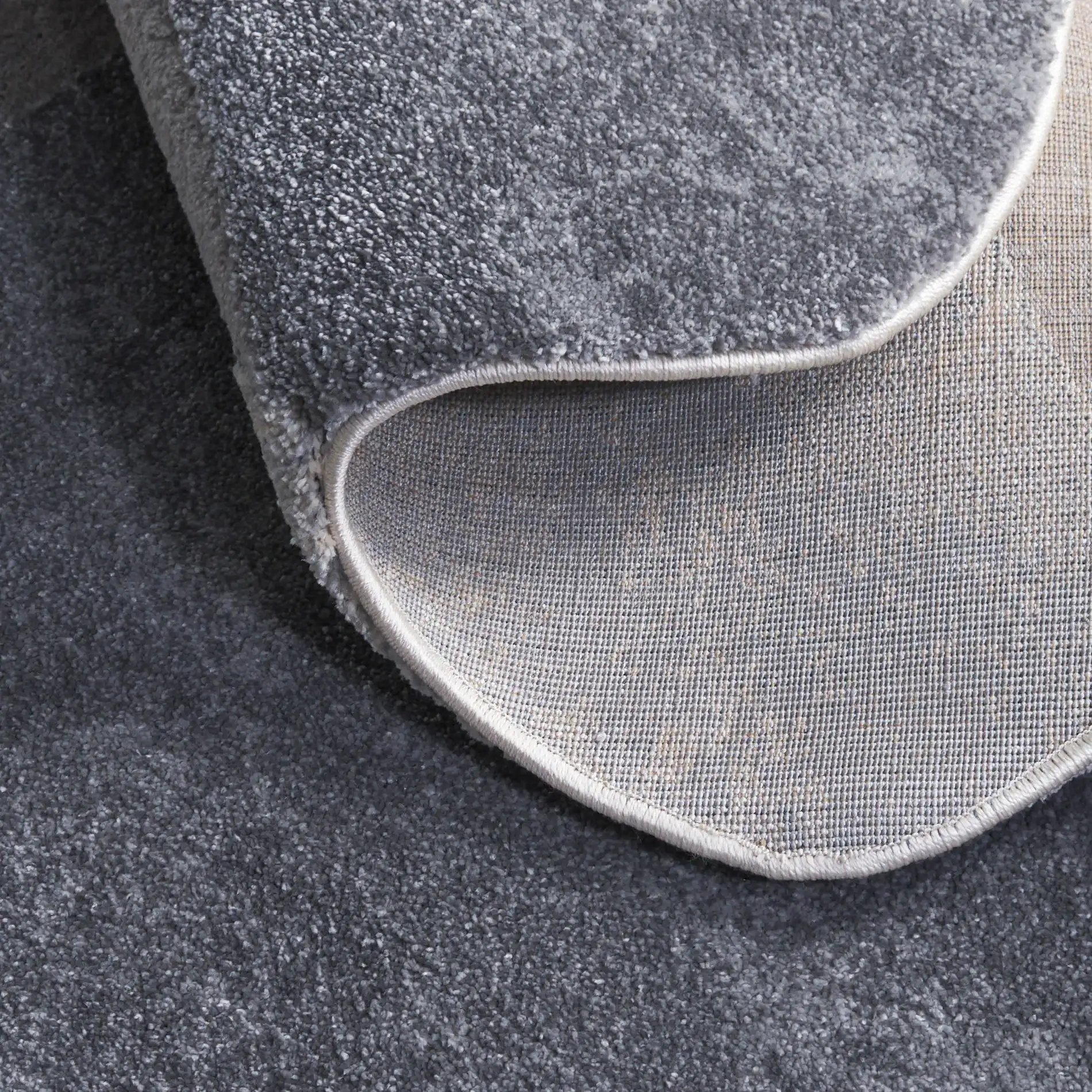 Contour Curved Abstract Rug in Gray / Ivory in a styled room