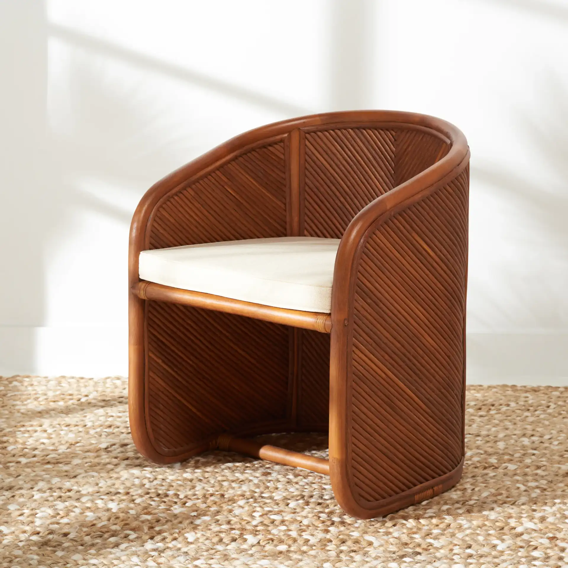 Barnette Rattan Pole Accent Chair in Amber / Beige in a styled room