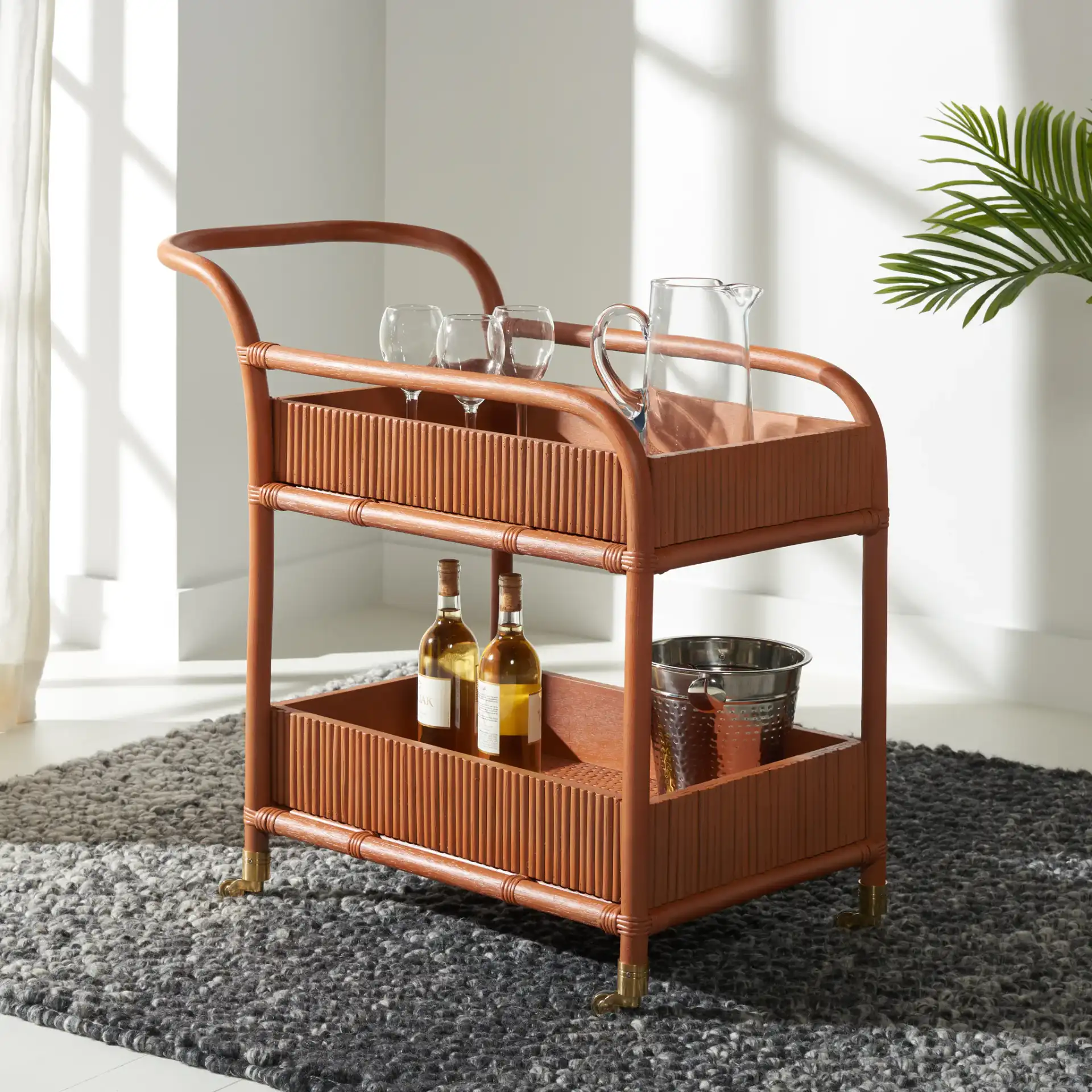 Barnette Rattan Pole Barcart in Amber in a styled room