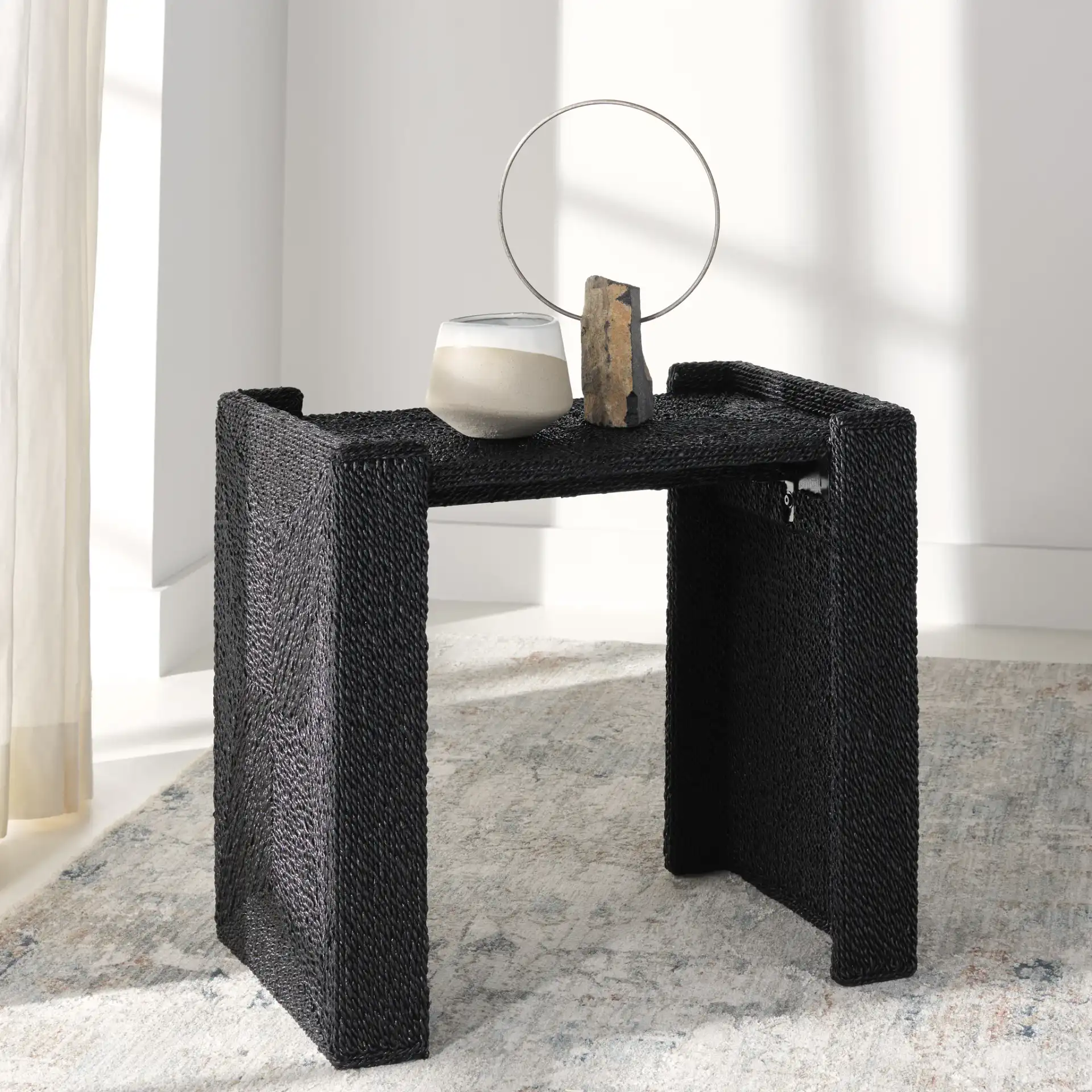 Wynima Sea Grass Accent Table in Black in a styled room