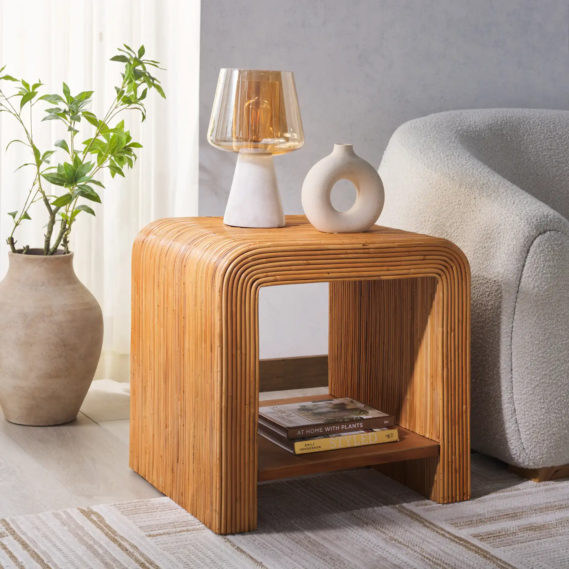 Dellabryn Rattan Accent Table in Natural in a styled room