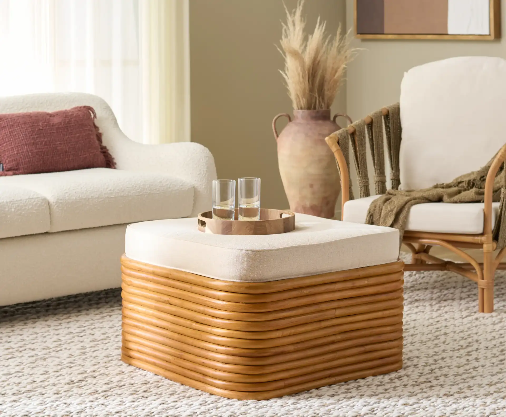 Flanders Rattan Pole Ottoman in Natural / White in a styled room