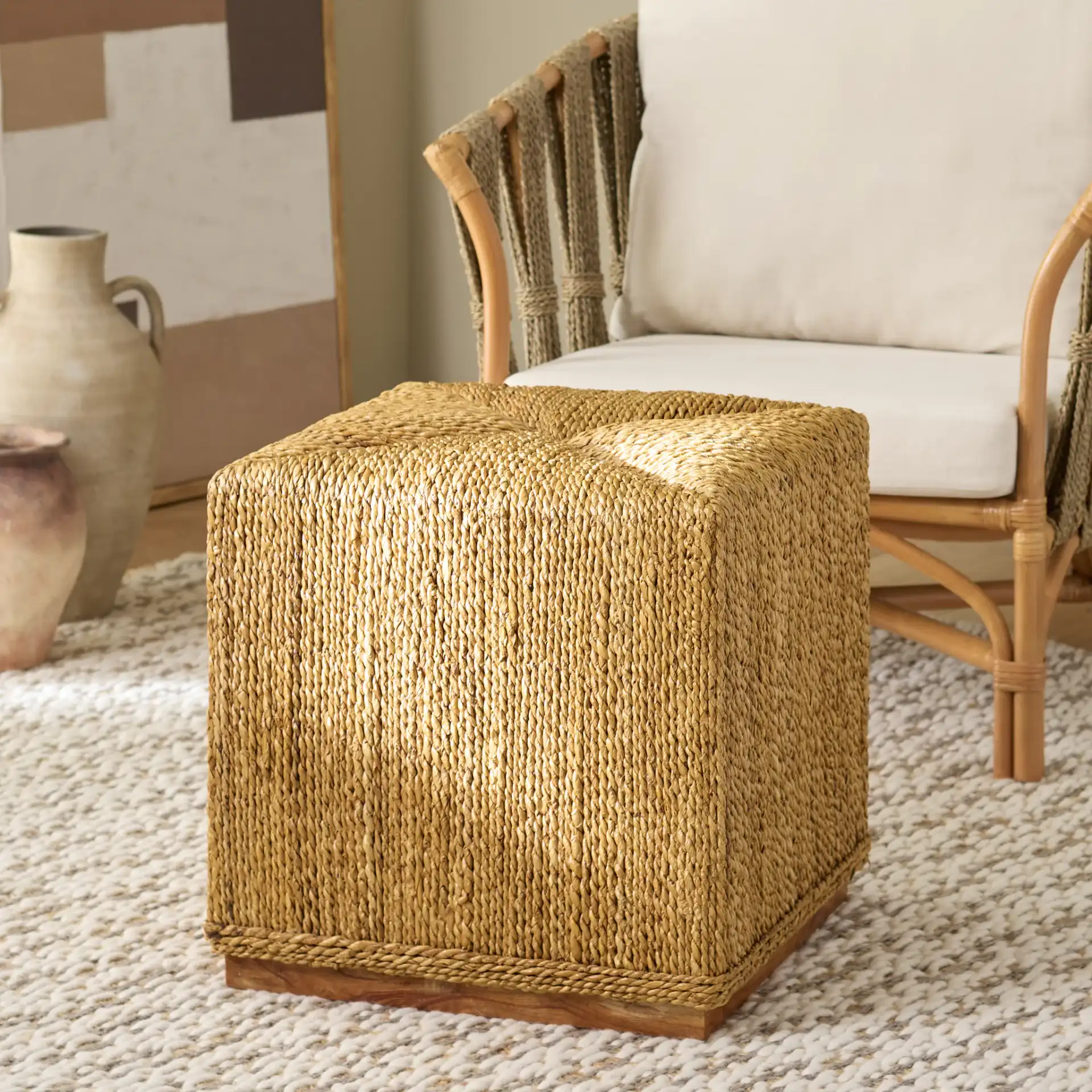 Donnabella Woven Abaca Ottoman in Natural in a styled room