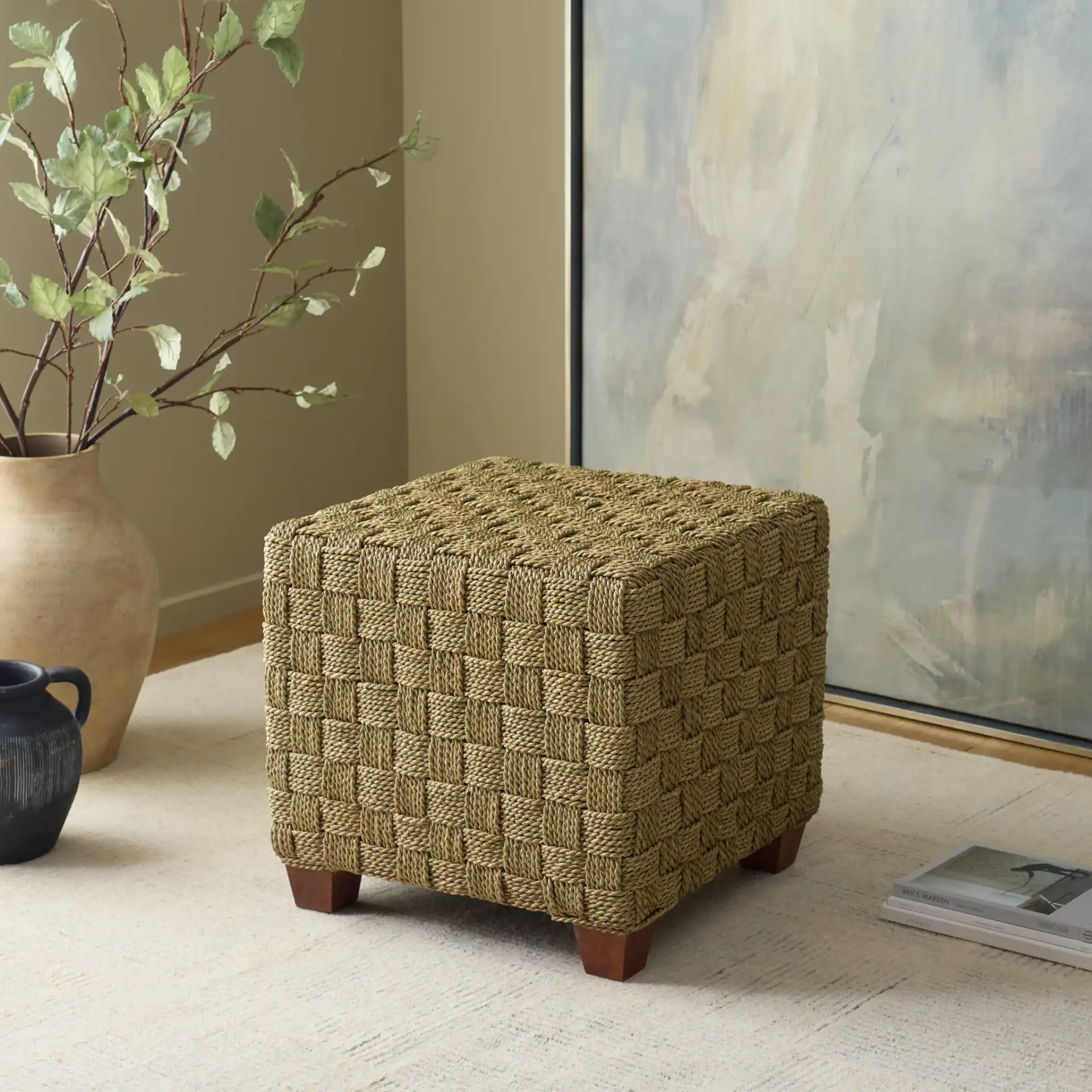 Norabelle Square Seagrass Ottoman in Natural in a styled room
